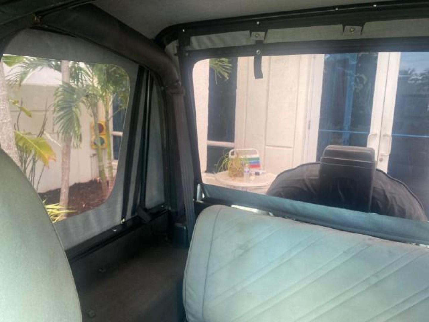 1994 Black /Gray Jeep Wrangler 4.0 6 CYL SE LOW MILES 87,813 (1J4FY29S8RP) with an 4.0L Straight 6-Cyl Engine engine, Automatic transmission, located at 4701 North Dixie Hwy, Pompano Beach, FL, 33064, (954) 422-2889, 26.240938, -80.123474 - OUR WEBPAGE FLORIDACARS1.COM HAS OVER 100 PHOTOS AND FREE CARFAX LINK 1994 JEEP WRANGLER SE AUTO AC BRAND NEW TOP WITH HARDWARE $ 2000 VALUE INCLUDED VIN: 1J4FY29S8RP433289 1 J 4 F Y 2 9 S 8 R P 4 3 3 2 8 9 UTILITY (BLAZER, JIMMY, SCOUT, ETC.) 4.0L I6 F GASOLINE REAR WHEEL DRIVE W/ 4X4 Features ABS - Photo#74