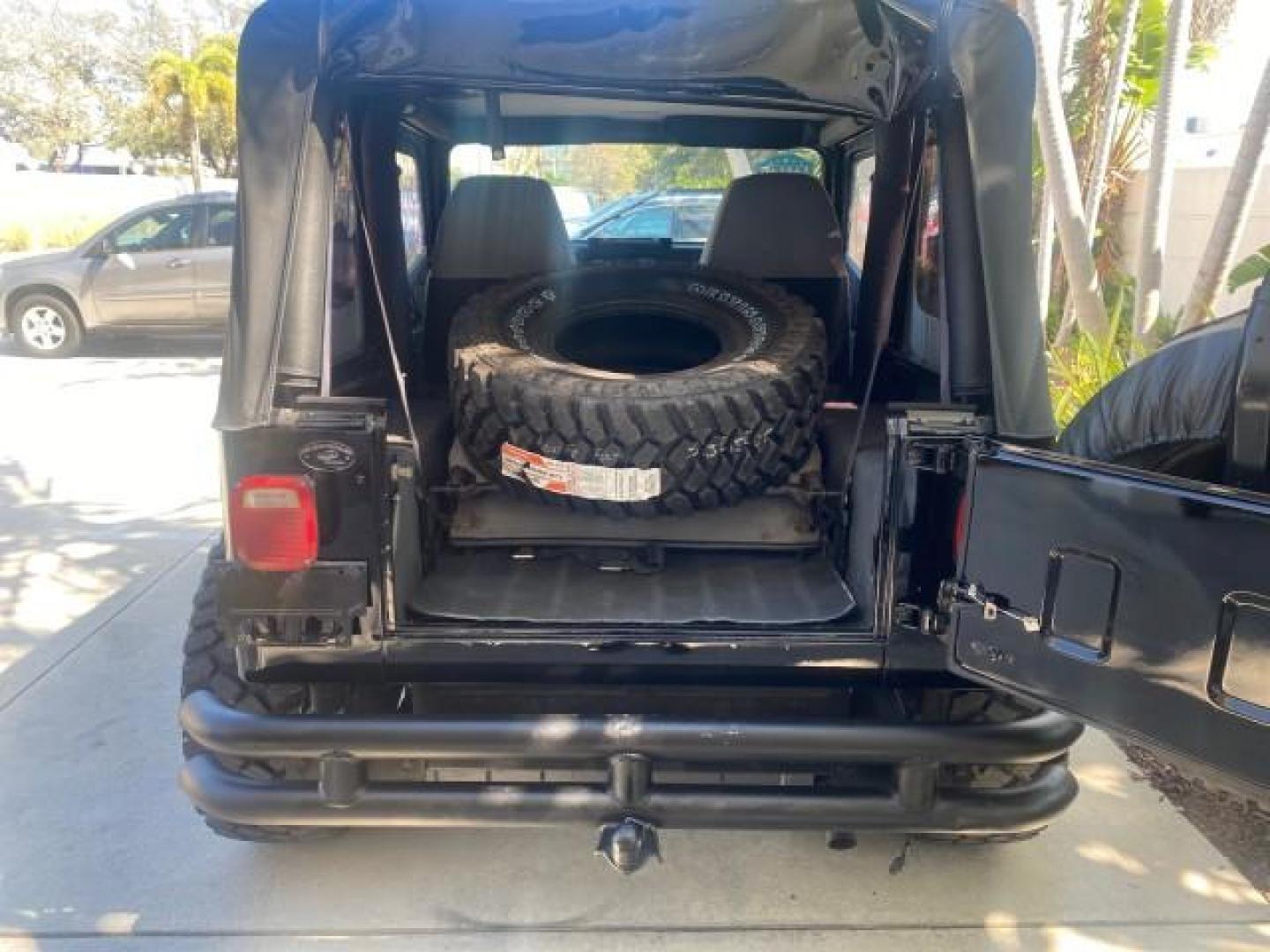 1994 Black /Gray Jeep Wrangler 4.0 6 CYL SE LOW MILES 87,813 (1J4FY29S8RP) with an 4.0L Straight 6-Cyl Engine engine, Automatic transmission, located at 4701 North Dixie Hwy, Pompano Beach, FL, 33064, (954) 422-2889, 26.240938, -80.123474 - OUR WEBPAGE FLORIDACARS1.COM HAS OVER 100 PHOTOS AND FREE CARFAX LINK 1994 JEEP WRANGLER SE AUTO AC BRAND NEW TOP WITH HARDWARE $ 2000 VALUE INCLUDED VIN: 1J4FY29S8RP433289 1 J 4 F Y 2 9 S 8 R P 4 3 3 2 8 9 UTILITY (BLAZER, JIMMY, SCOUT, ETC.) 4.0L I6 F GASOLINE REAR WHEEL DRIVE W/ 4X4 Features ABS - Photo#78