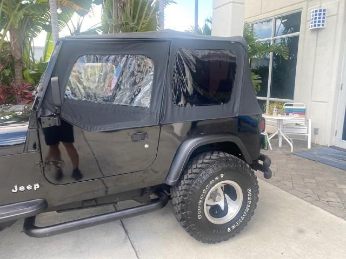 1994 Black /Gray Jeep Wrangler 4.0 6 CYL SE LOW MILES 87,813 (1J4FY29S8RP) with an 4.0L Straight 6-Cyl Engine engine, Automatic transmission, located at 4701 North Dixie Hwy, Pompano Beach, FL, 33064, (954) 422-2889, 26.240938, -80.123474 - OUR WEBPAGE FLORIDACARS1.COM HAS OVER 100 PHOTOS AND FREE CARFAX LINK 1994 JEEP WRANGLER SE AUTO AC BRAND NEW TOP WITH HARDWARE $ 2000 VALUE INCLUDED VIN: 1J4FY29S8RP433289 1 J 4 F Y 2 9 S 8 R P 4 3 3 2 8 9 UTILITY (BLAZER, JIMMY, SCOUT, ETC.) 4.0L I6 F GASOLINE REAR WHEEL DRIVE W/ 4X4 Features ABS - Photo#79