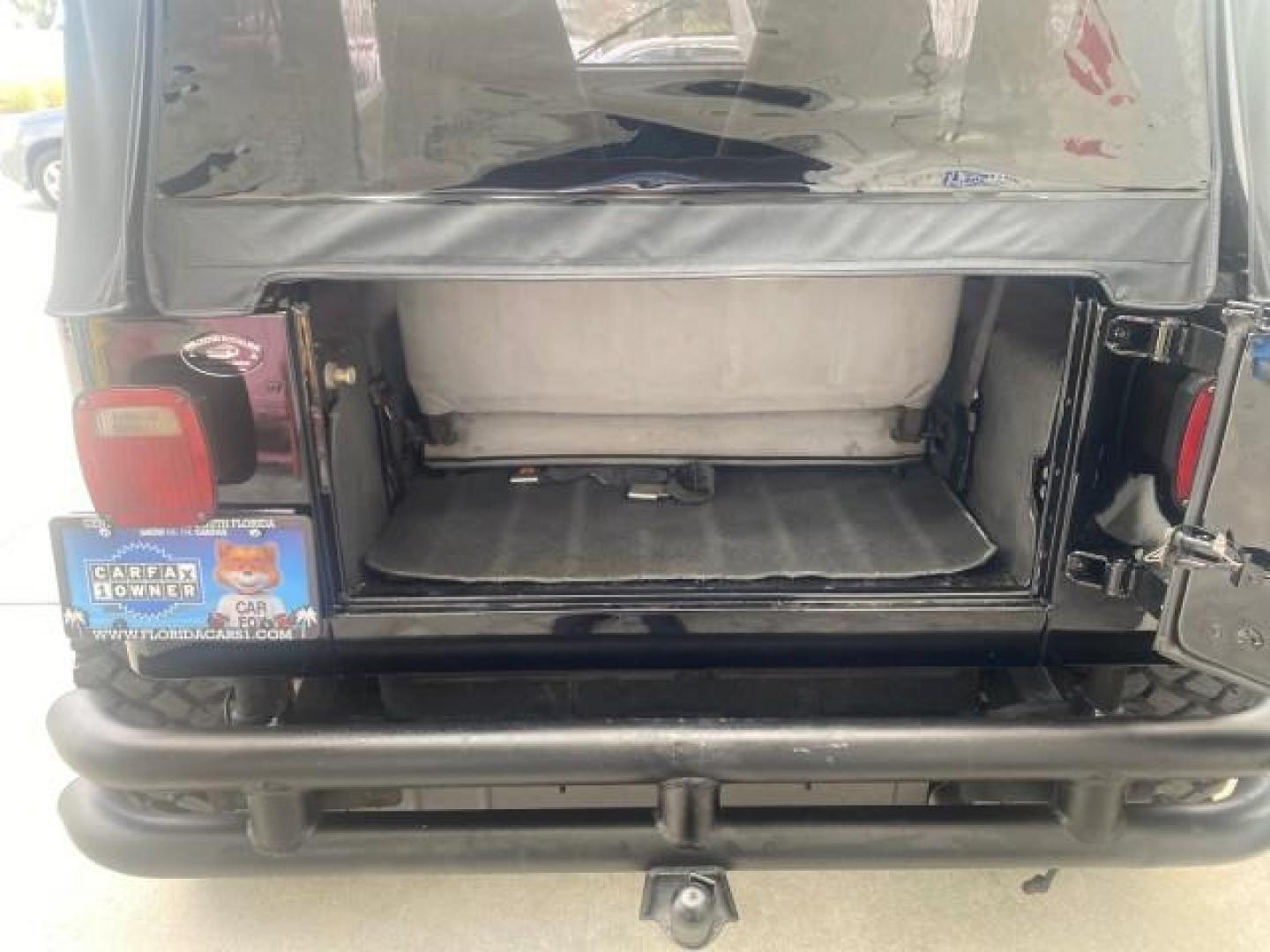 1994 Black /Gray Jeep Wrangler 4.0 6 CYL SE LOW MILES 87,813 (1J4FY29S8RP) with an 4.0L Straight 6-Cyl Engine engine, Automatic transmission, located at 4701 North Dixie Hwy, Pompano Beach, FL, 33064, (954) 422-2889, 26.240938, -80.123474 - OUR WEBPAGE FLORIDACARS1.COM HAS OVER 100 PHOTOS AND FREE CARFAX LINK 1994 JEEP WRANGLER SE AUTO AC BRAND NEW TOP WITH HARDWARE $ 2000 VALUE INCLUDED VIN: 1J4FY29S8RP433289 1 J 4 F Y 2 9 S 8 R P 4 3 3 2 8 9 UTILITY (BLAZER, JIMMY, SCOUT, ETC.) 4.0L I6 F GASOLINE REAR WHEEL DRIVE W/ 4X4 Features ABS - Photo#91