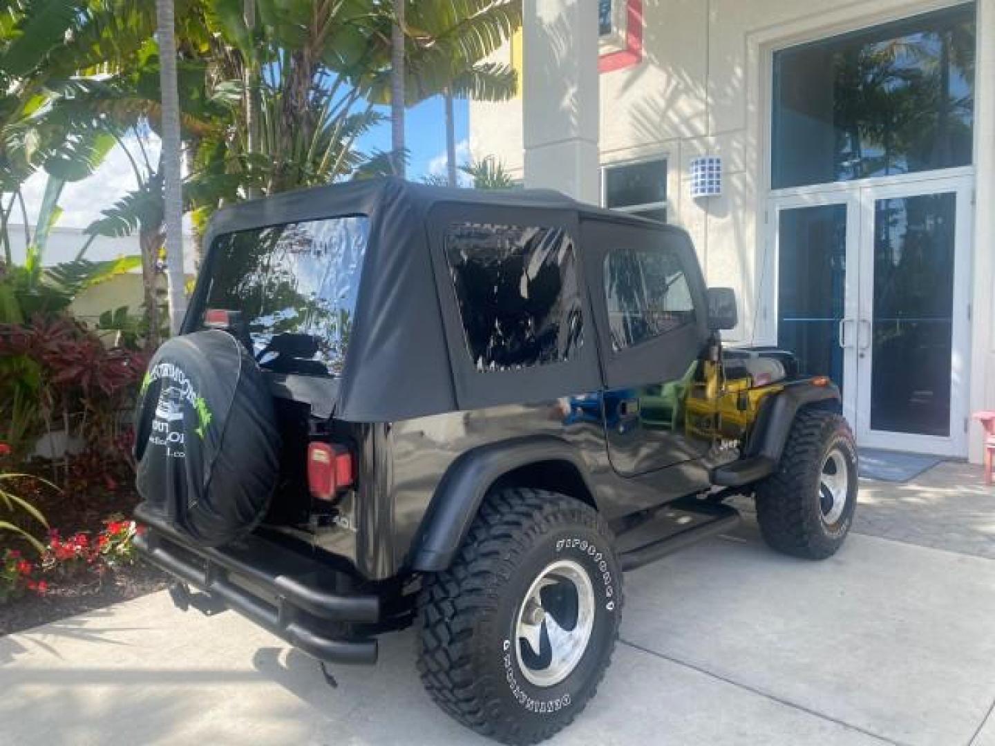 1994 Black /Gray Jeep Wrangler 4.0 6 CYL SE LOW MILES 87,813 (1J4FY29S8RP) with an 4.0L Straight 6-Cyl Engine engine, Automatic transmission, located at 4701 North Dixie Hwy, Pompano Beach, FL, 33064, (954) 422-2889, 26.240938, -80.123474 - OUR WEBPAGE FLORIDACARS1.COM HAS OVER 100 PHOTOS AND FREE CARFAX LINK 1994 JEEP WRANGLER SE AUTO AC BRAND NEW TOP WITH HARDWARE $ 2000 VALUE INCLUDED VIN: 1J4FY29S8RP433289 1 J 4 F Y 2 9 S 8 R P 4 3 3 2 8 9 UTILITY (BLAZER, JIMMY, SCOUT, ETC.) 4.0L I6 F GASOLINE REAR WHEEL DRIVE W/ 4X4 Features ABS - Photo#96