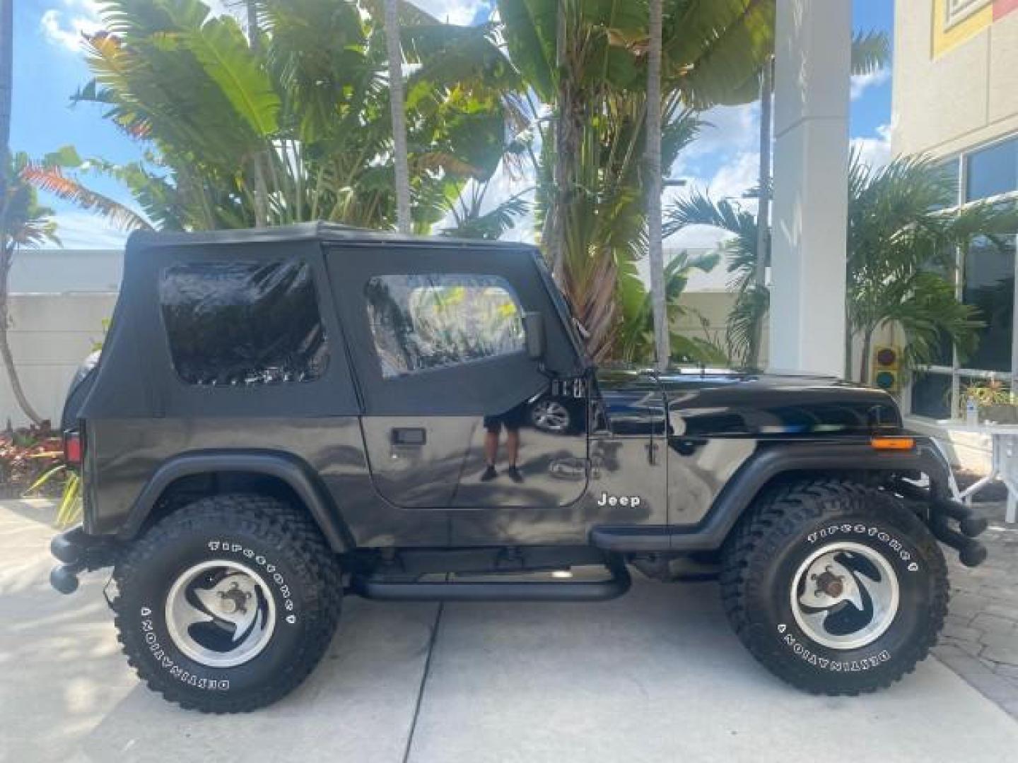 1994 Black /Gray Jeep Wrangler 4.0 6 CYL SE LOW MILES 87,813 (1J4FY29S8RP) with an 4.0L Straight 6-Cyl Engine engine, Automatic transmission, located at 4701 North Dixie Hwy, Pompano Beach, FL, 33064, (954) 422-2889, 26.240938, -80.123474 - OUR WEBPAGE FLORIDACARS1.COM HAS OVER 100 PHOTOS AND FREE CARFAX LINK 1994 JEEP WRANGLER SE AUTO AC BRAND NEW TOP WITH HARDWARE $ 2000 VALUE INCLUDED VIN: 1J4FY29S8RP433289 1 J 4 F Y 2 9 S 8 R P 4 3 3 2 8 9 UTILITY (BLAZER, JIMMY, SCOUT, ETC.) 4.0L I6 F GASOLINE REAR WHEEL DRIVE W/ 4X4 Features ABS - Photo#98