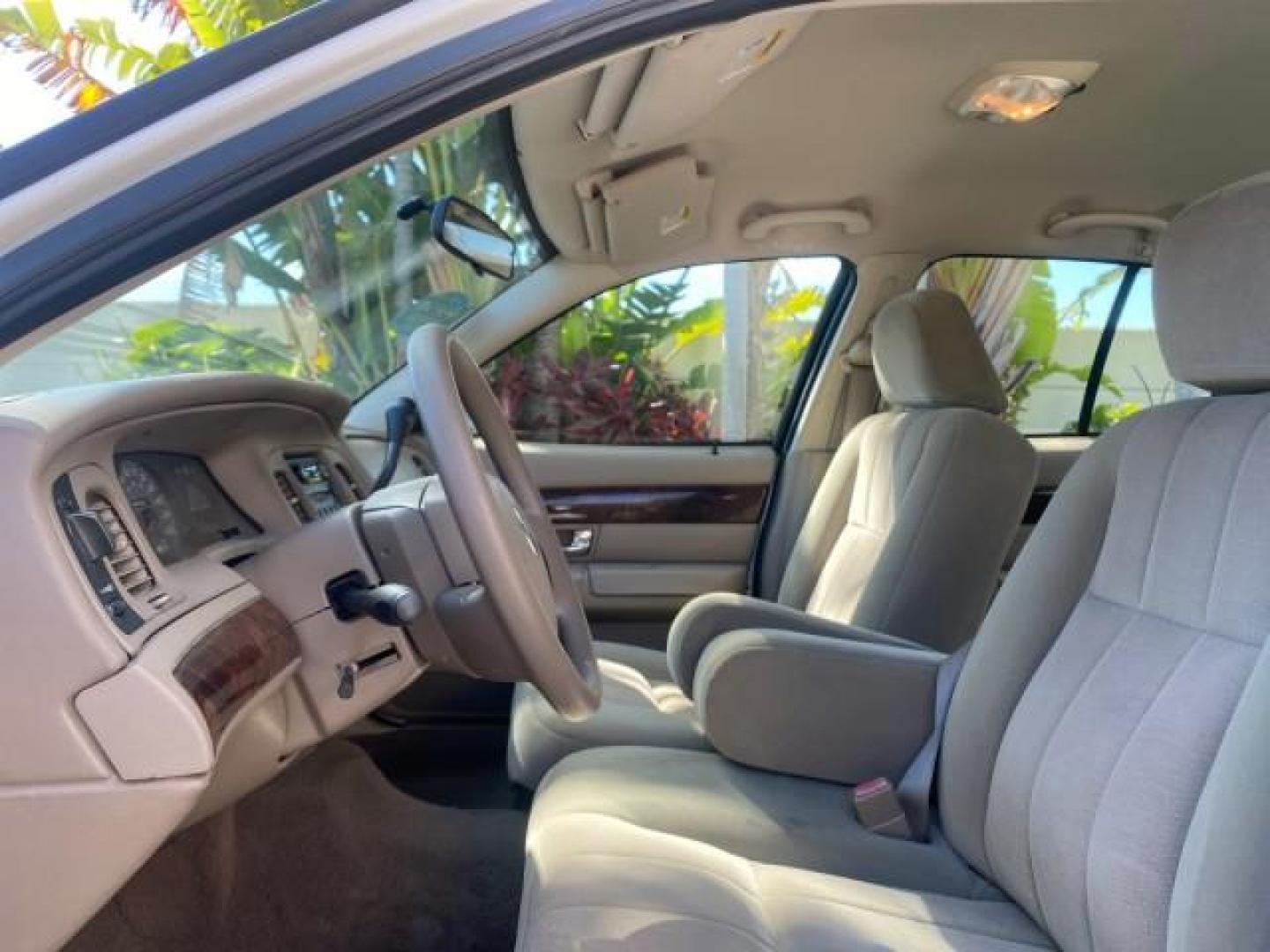 2005 Vibrant White /Medium Parchment Mercury Grand Marquis GS LOW MILES 49,348 (2MEFM74W85X) with an 4.6L OHC SEFI V8 Engine engine, Automatic transmission, located at 4701 North Dixie Hwy, Pompano Beach, FL, 33064, (954) 422-2889, 26.240938, -80.123474 - OUR WEBPAGE FLORIDACARS1.COM HAS OVER 100 PHOTOS AND FREE CARFAX LINK 2005 MERCURY GRAND MARQUIS GS VIN: 2MEFM74W85X603873 2 M E F M 7 4 W 8 5 X 6 0 3 8 7 3 SEDAN 4 DR 4.6L V8 F DOHC GASOLINE 25 MPG REAR WHEEL DRIVE Features ABS Brakes Air Conditioning AM/FM Stereo Automatic Transmission CD Audio Cl- Photo#43