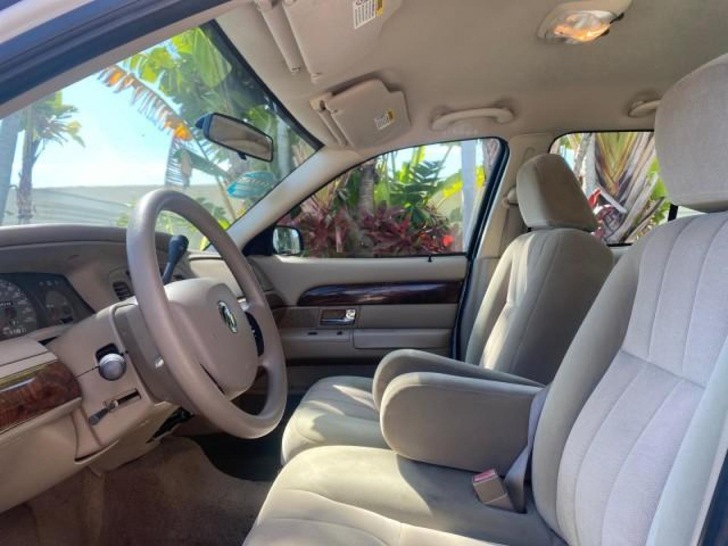 2005 Vibrant White /Medium Parchment Mercury Grand Marquis GS LOW MILES 49,348 (2MEFM74W85X) with an 4.6L OHC SEFI V8 Engine engine, Automatic transmission, located at 4701 North Dixie Hwy, Pompano Beach, FL, 33064, (954) 422-2889, 26.240938, -80.123474 - OUR WEBPAGE FLORIDACARS1.COM HAS OVER 100 PHOTOS AND FREE CARFAX LINK 2005 MERCURY GRAND MARQUIS GS VIN: 2MEFM74W85X603873 2 M E F M 7 4 W 8 5 X 6 0 3 8 7 3 SEDAN 4 DR 4.6L V8 F DOHC GASOLINE 25 MPG REAR WHEEL DRIVE Features ABS Brakes Air Conditioning AM/FM Stereo Automatic Transmission CD Audio Cl- Photo#44