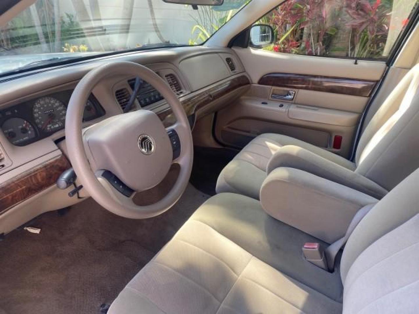 2005 Vibrant White /Medium Parchment Mercury Grand Marquis GS LOW MILES 49,348 (2MEFM74W85X) with an 4.6L OHC SEFI V8 Engine engine, Automatic transmission, located at 4701 North Dixie Hwy, Pompano Beach, FL, 33064, (954) 422-2889, 26.240938, -80.123474 - OUR WEBPAGE FLORIDACARS1.COM HAS OVER 100 PHOTOS AND FREE CARFAX LINK 2005 MERCURY GRAND MARQUIS GS VIN: 2MEFM74W85X603873 2 M E F M 7 4 W 8 5 X 6 0 3 8 7 3 SEDAN 4 DR 4.6L V8 F DOHC GASOLINE 25 MPG REAR WHEEL DRIVE Features ABS Brakes Air Conditioning AM/FM Stereo Automatic Transmission CD Audio Cl- Photo#45