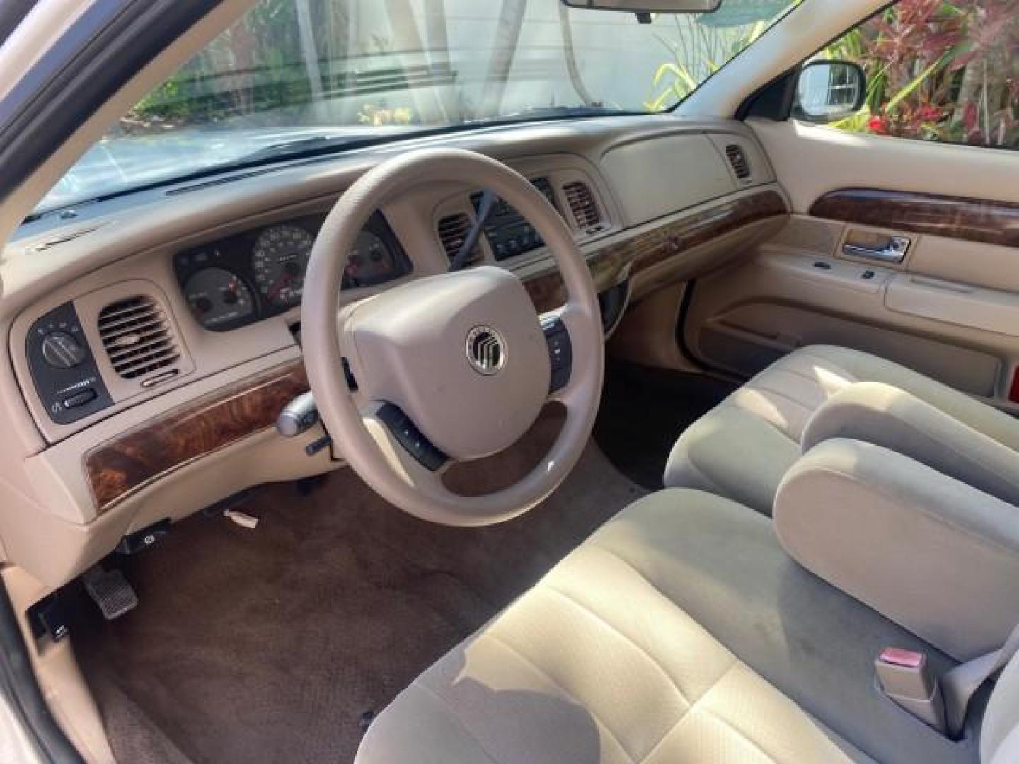 2005 Vibrant White /Medium Parchment Mercury Grand Marquis GS LOW MILES 49,348 (2MEFM74W85X) with an 4.6L OHC SEFI V8 Engine engine, Automatic transmission, located at 4701 North Dixie Hwy, Pompano Beach, FL, 33064, (954) 422-2889, 26.240938, -80.123474 - OUR WEBPAGE FLORIDACARS1.COM HAS OVER 100 PHOTOS AND FREE CARFAX LINK 2005 MERCURY GRAND MARQUIS GS VIN: 2MEFM74W85X603873 2 M E F M 7 4 W 8 5 X 6 0 3 8 7 3 SEDAN 4 DR 4.6L V8 F DOHC GASOLINE 25 MPG REAR WHEEL DRIVE Features ABS Brakes Air Conditioning AM/FM Stereo Automatic Transmission CD Audio Cl- Photo#46