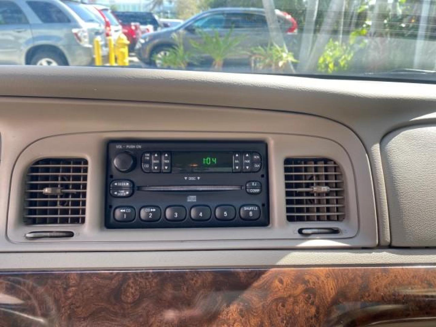 2005 Vibrant White /Medium Parchment Mercury Grand Marquis GS LOW MILES 49,348 (2MEFM74W85X) with an 4.6L OHC SEFI V8 Engine engine, Automatic transmission, located at 4701 North Dixie Hwy, Pompano Beach, FL, 33064, (954) 422-2889, 26.240938, -80.123474 - OUR WEBPAGE FLORIDACARS1.COM HAS OVER 100 PHOTOS AND FREE CARFAX LINK 2005 MERCURY GRAND MARQUIS GS VIN: 2MEFM74W85X603873 2 M E F M 7 4 W 8 5 X 6 0 3 8 7 3 SEDAN 4 DR 4.6L V8 F DOHC GASOLINE 25 MPG REAR WHEEL DRIVE Features ABS Brakes Air Conditioning AM/FM Stereo Automatic Transmission CD Audio Cl- Photo#55