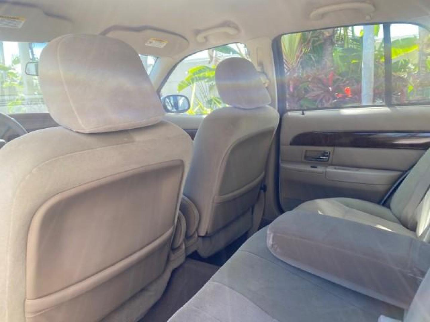 2005 Vibrant White /Medium Parchment Mercury Grand Marquis GS LOW MILES 49,348 (2MEFM74W85X) with an 4.6L OHC SEFI V8 Engine engine, Automatic transmission, located at 4701 North Dixie Hwy, Pompano Beach, FL, 33064, (954) 422-2889, 26.240938, -80.123474 - OUR WEBPAGE FLORIDACARS1.COM HAS OVER 100 PHOTOS AND FREE CARFAX LINK 2005 MERCURY GRAND MARQUIS GS VIN: 2MEFM74W85X603873 2 M E F M 7 4 W 8 5 X 6 0 3 8 7 3 SEDAN 4 DR 4.6L V8 F DOHC GASOLINE 25 MPG REAR WHEEL DRIVE Features ABS Brakes Air Conditioning AM/FM Stereo Automatic Transmission CD Audio Cl- Photo#69