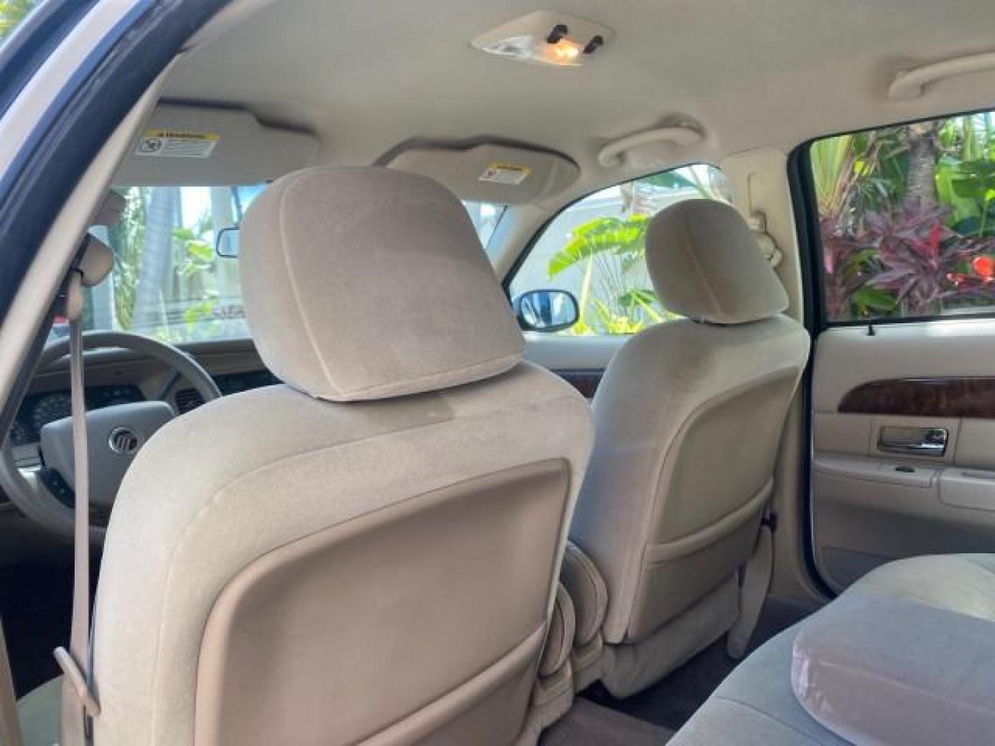 2005 Vibrant White /Medium Parchment Mercury Grand Marquis GS LOW MILES 49,348 (2MEFM74W85X) with an 4.6L OHC SEFI V8 Engine engine, Automatic transmission, located at 4701 North Dixie Hwy, Pompano Beach, FL, 33064, (954) 422-2889, 26.240938, -80.123474 - OUR WEBPAGE FLORIDACARS1.COM HAS OVER 100 PHOTOS AND FREE CARFAX LINK 2005 MERCURY GRAND MARQUIS GS VIN: 2MEFM74W85X603873 2 M E F M 7 4 W 8 5 X 6 0 3 8 7 3 SEDAN 4 DR 4.6L V8 F DOHC GASOLINE 25 MPG REAR WHEEL DRIVE Features ABS Brakes Air Conditioning AM/FM Stereo Automatic Transmission CD Audio Cl- Photo#70