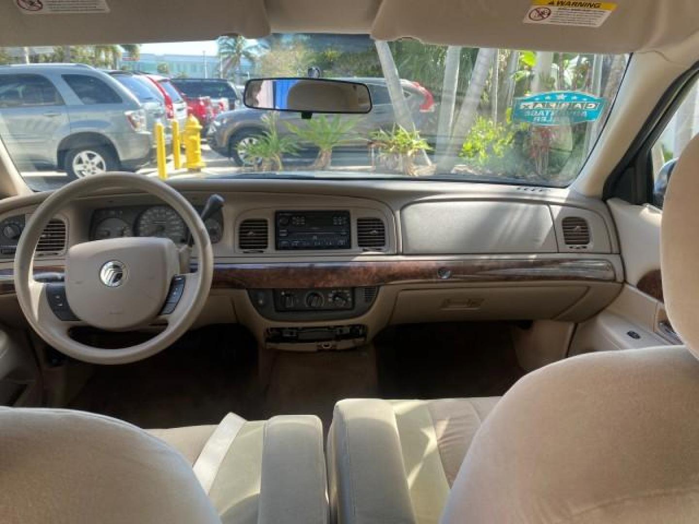 2005 Vibrant White /Medium Parchment Mercury Grand Marquis GS LOW MILES 49,348 (2MEFM74W85X) with an 4.6L OHC SEFI V8 Engine engine, Automatic transmission, located at 4701 North Dixie Hwy, Pompano Beach, FL, 33064, (954) 422-2889, 26.240938, -80.123474 - OUR WEBPAGE FLORIDACARS1.COM HAS OVER 100 PHOTOS AND FREE CARFAX LINK 2005 MERCURY GRAND MARQUIS GS VIN: 2MEFM74W85X603873 2 M E F M 7 4 W 8 5 X 6 0 3 8 7 3 SEDAN 4 DR 4.6L V8 F DOHC GASOLINE 25 MPG REAR WHEEL DRIVE Features ABS Brakes Air Conditioning AM/FM Stereo Automatic Transmission CD Audio Cl- Photo#71