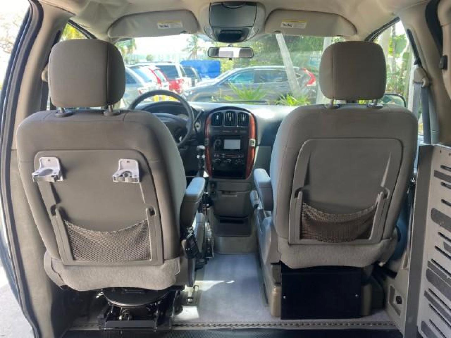 2006 Butane Blue Pearl /Med Slate Gray Chrysler T and C BRAUN ENTERVAN HANDICAP LOW MILES 64,097 (1A4GP44R76B) with an 3.3L OHV V6 Engine engine, Automatic transmission, located at 4701 North Dixie Hwy, Pompano Beach, FL, 33064, (954) 422-2889, 26.240938, -80.123474 - OUR WEBPAGE FLORIDACARS1.COM HAS OVER 100 PHOTOS AND FREE CARFAX LINK 2006 CHRYSLER TOWN AND COUNTRY LX BRAUN ENTERVAN $20,000 PLUS CONVERSION POWER RAMP DRIVER SEAT SWIVELS VIN: 1A4GP44R76B751954 1 A 4 G P 4 4 R 7 6 B 7 5 1 9 5 4 VAN 3.3L V6 F OHV 24V GASOLINE 26 MPG FRONT WHEEL DRIVE Features ABS- Photo#97
