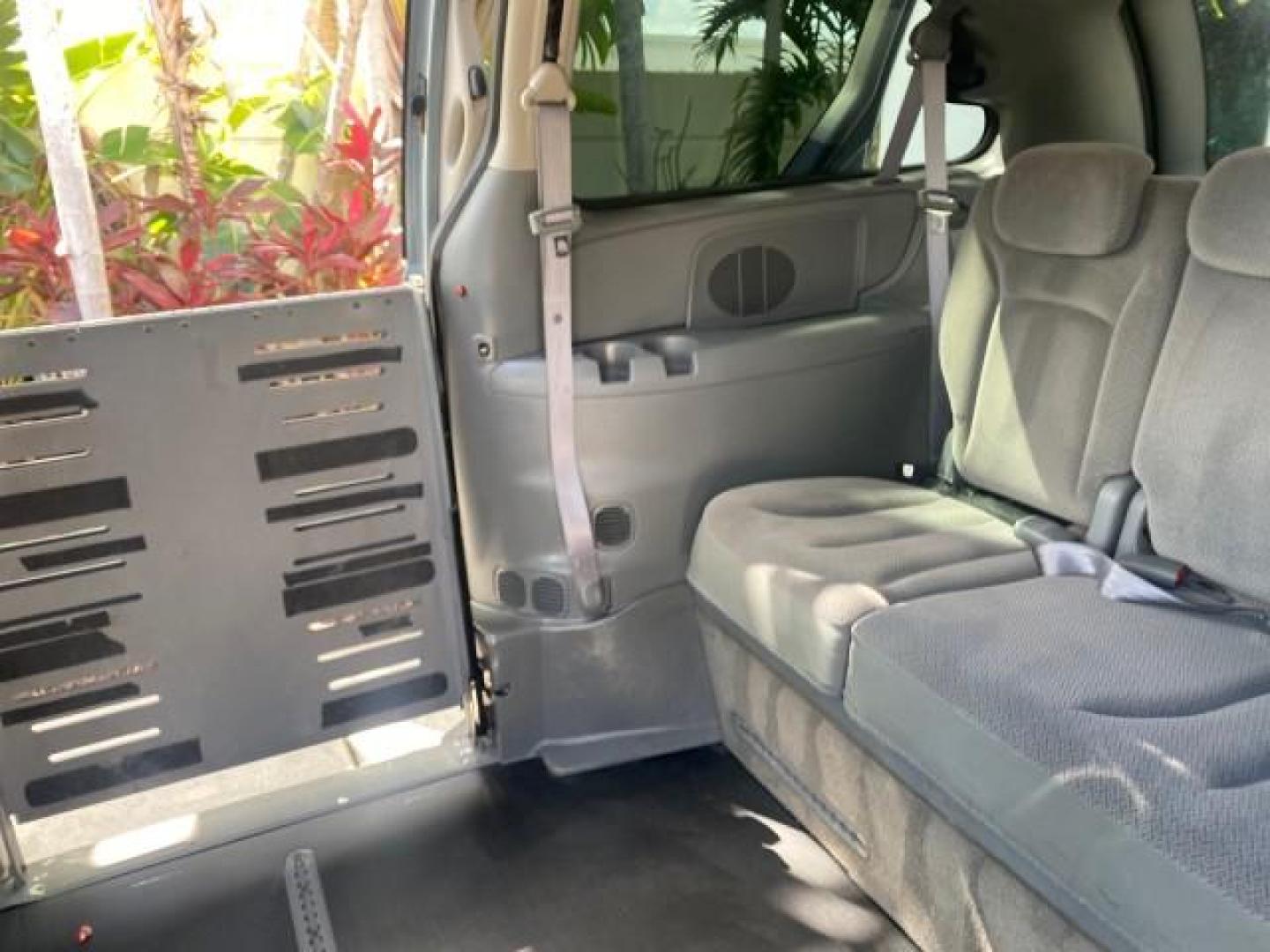 2006 Butane Blue Pearl /Med Slate Gray Chrysler T and C BRAUN ENTERVAN HANDICAP LOW MILES 64,097 (1A4GP44R76B) with an 3.3L OHV V6 Engine engine, Automatic transmission, located at 4701 North Dixie Hwy, Pompano Beach, FL, 33064, (954) 422-2889, 26.240938, -80.123474 - OUR WEBPAGE FLORIDACARS1.COM HAS OVER 100 PHOTOS AND FREE CARFAX LINK 2006 CHRYSLER TOWN AND COUNTRY LX BRAUN ENTERVAN $20,000 PLUS CONVERSION POWER RAMP DRIVER SEAT SWIVELS VIN: 1A4GP44R76B751954 1 A 4 G P 4 4 R 7 6 B 7 5 1 9 5 4 VAN 3.3L V6 F OHV 24V GASOLINE 26 MPG FRONT WHEEL DRIVE Features ABS- Photo#99