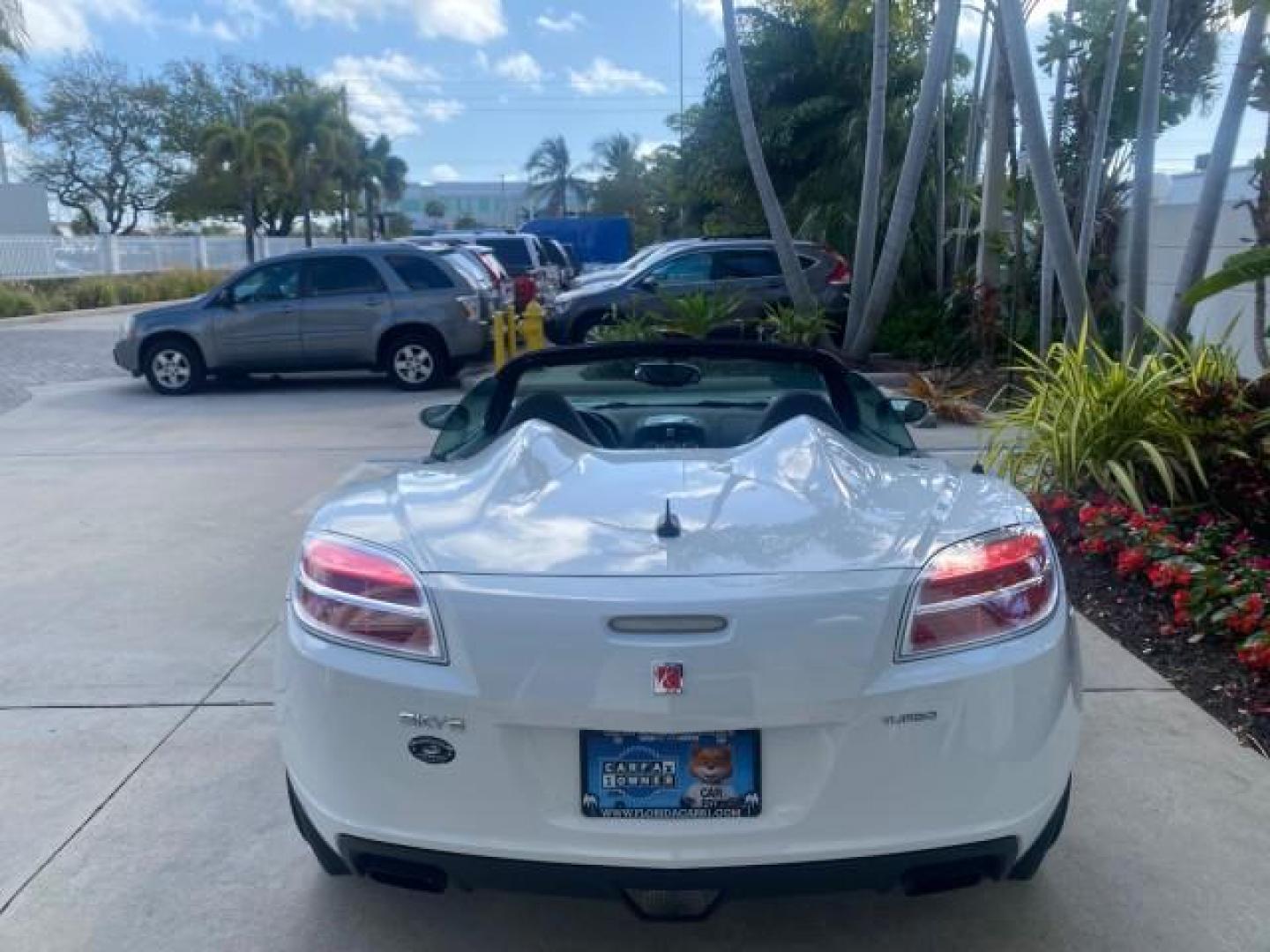 2008 Polar White /Black Saturn Sky Red Line LOW MILES 29,810 SOFT TOP (1G8MF35X78Y) with an Turbocharged And Intercooled Ecotec 2.0L VVT DOHC 4-Cyl Aluminum Engine engine, Automatic transmission, located at 4701 North Dixie Hwy, Pompano Beach, FL, 33064, (954) 422-2889, 26.240938, -80.123474 - OUR WEBPAGE FLORIDACARS1.COM HAS OVER 100 PHOTOS AND FREE CARFAX LINK 2008 SATURN SKY RED LINE TOP OF THE LINE TURBO FAST VIN: 1G8MF35X78Y121221 1 G 8 M F 3 5 X 7 8 Y 1 2 1 2 2 1 CONVERTIBLE 2.0L I4 F DOHC GASOLINE 31 MPG REAR WHEEL DRIVE Features ABS Brakes Air Conditioning Alloy Wheels AM/FM Stere - Photo#45