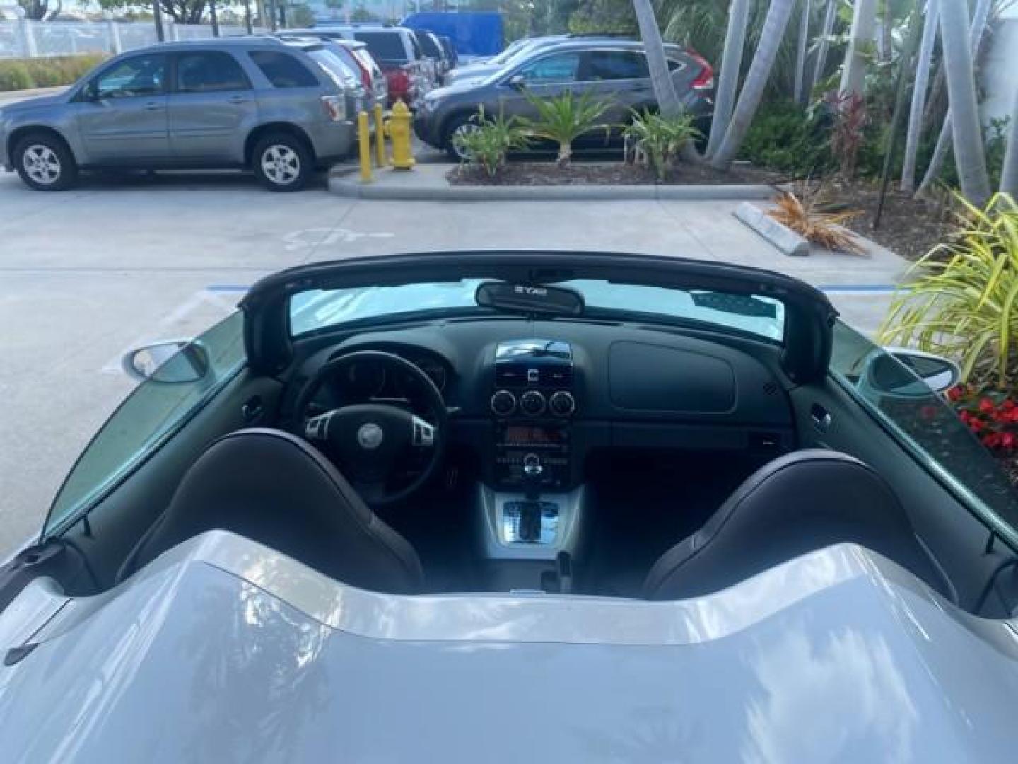 2008 Polar White /Black Saturn Sky Red Line LOW MILES 29,810 SOFT TOP (1G8MF35X78Y) with an Turbocharged And Intercooled Ecotec 2.0L VVT DOHC 4-Cyl Aluminum Engine engine, Automatic transmission, located at 4701 North Dixie Hwy, Pompano Beach, FL, 33064, (954) 422-2889, 26.240938, -80.123474 - OUR WEBPAGE FLORIDACARS1.COM HAS OVER 100 PHOTOS AND FREE CARFAX LINK 2008 SATURN SKY RED LINE TOP OF THE LINE TURBO FAST VIN: 1G8MF35X78Y121221 1 G 8 M F 3 5 X 7 8 Y 1 2 1 2 2 1 CONVERTIBLE 2.0L I4 F DOHC GASOLINE 31 MPG REAR WHEEL DRIVE Features ABS Brakes Air Conditioning Alloy Wheels AM/FM Stere - Photo#46