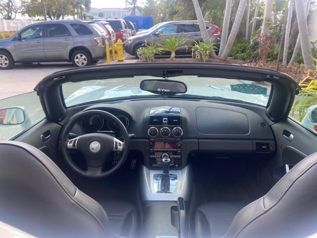 2008 Polar White /Black Saturn Sky Red Line LOW MILES 29,810 SOFT TOP (1G8MF35X78Y) with an Turbocharged And Intercooled Ecotec 2.0L VVT DOHC 4-Cyl Aluminum Engine engine, Automatic transmission, located at 4701 North Dixie Hwy, Pompano Beach, FL, 33064, (954) 422-2889, 26.240938, -80.123474 - OUR WEBPAGE FLORIDACARS1.COM HAS OVER 100 PHOTOS AND FREE CARFAX LINK 2008 SATURN SKY RED LINE TOP OF THE LINE TURBO FAST VIN: 1G8MF35X78Y121221 1 G 8 M F 3 5 X 7 8 Y 1 2 1 2 2 1 CONVERTIBLE 2.0L I4 F DOHC GASOLINE 31 MPG REAR WHEEL DRIVE Features ABS Brakes Air Conditioning Alloy Wheels AM/FM Stere - Photo#47
