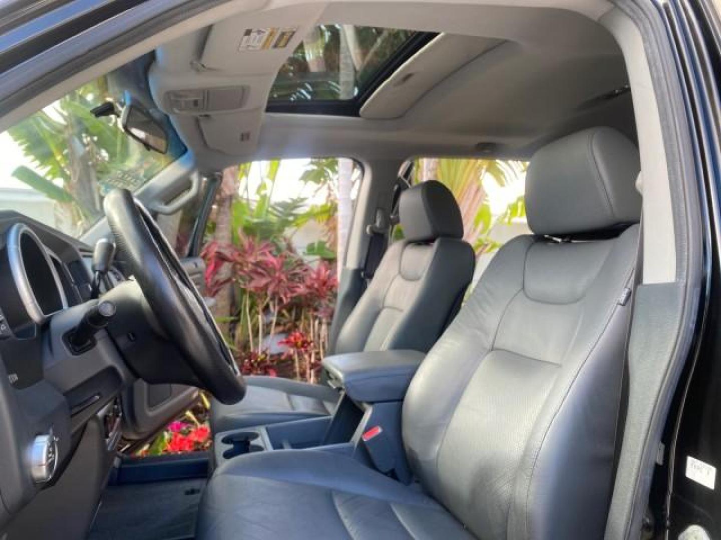 2007 Formal Black /Gray Honda Ridgeline RTL w/Leather 1 OWNER FL (2HJYK16557H) with an 3.5L SOHC PGM-FI 24-Valve VTEC V6 Engine engine, Automatic transmission, located at 4701 North Dixie Hwy, Pompano Beach, FL, 33064, (954) 422-2889, 26.240938, -80.123474 - OUR WEBPAGE FLORIDACARS1.COM HAS OVER 100 PHOTOS AND FREE CARFAX LINK 2007 HONDA RIDGELINE RTL 1 OWNER NEW $35,535 VIN: 2HJYK16557H543559 2 H J Y K 1 6 5 5 7 H 5 4 3 5 5 9 CREW PICKUP 3.5L V6 F SOHC 24V GASOLINE 21 MPG FRONT WHEEL DRIVE W/ 4X4 Features ABS Brakes Air Conditioning Alloy Wheels AM/FM - Photo#10