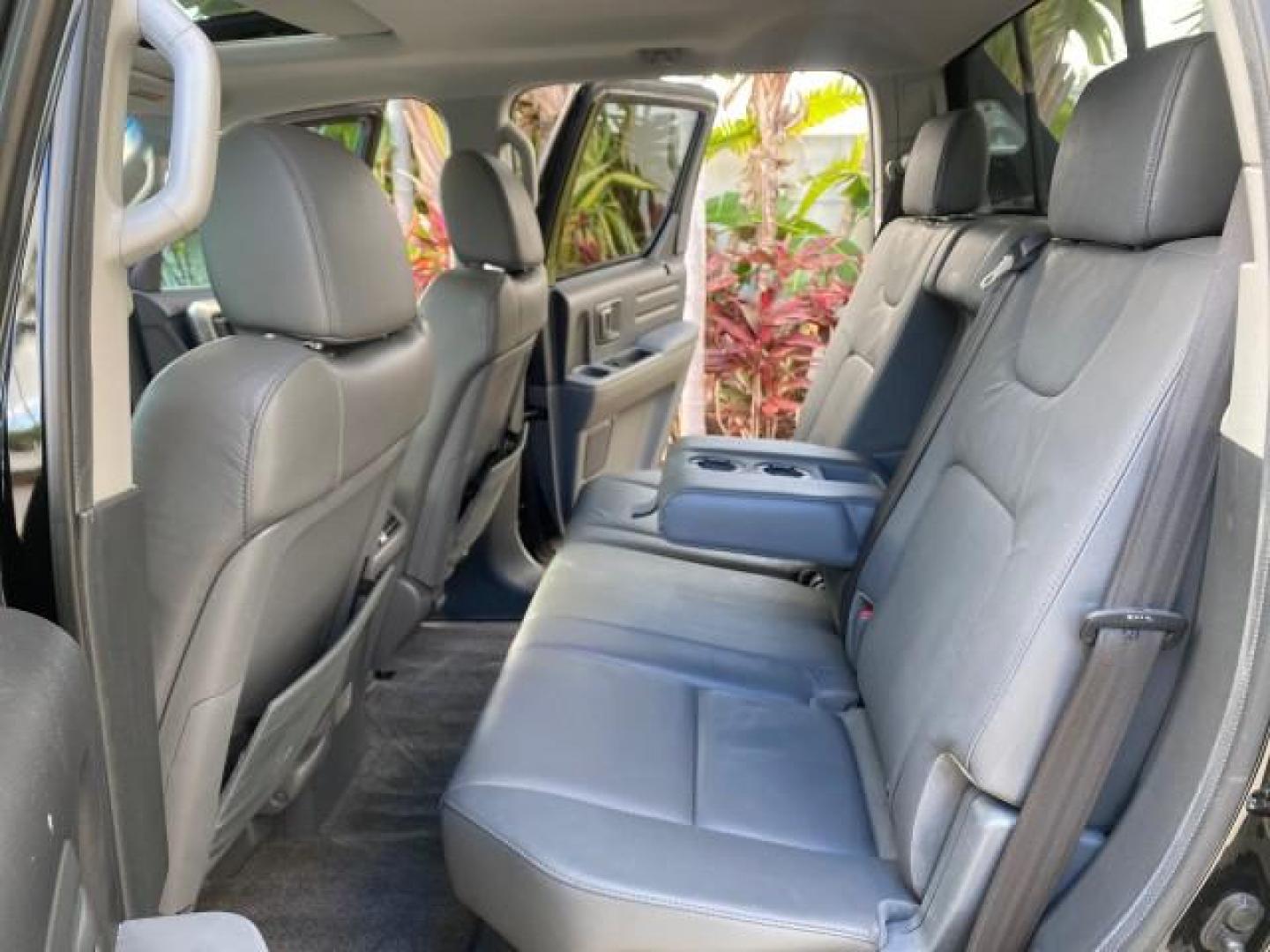 2007 Formal Black /Gray Honda Ridgeline RTL w/Leather 1 OWNER FL (2HJYK16557H) with an 3.5L SOHC PGM-FI 24-Valve VTEC V6 Engine engine, Automatic transmission, located at 4701 North Dixie Hwy, Pompano Beach, FL, 33064, (954) 422-2889, 26.240938, -80.123474 - OUR WEBPAGE FLORIDACARS1.COM HAS OVER 100 PHOTOS AND FREE CARFAX LINK 2007 HONDA RIDGELINE RTL 1 OWNER NEW $35,535 VIN: 2HJYK16557H543559 2 H J Y K 1 6 5 5 7 H 5 4 3 5 5 9 CREW PICKUP 3.5L V6 F SOHC 24V GASOLINE 21 MPG FRONT WHEEL DRIVE W/ 4X4 Features ABS Brakes Air Conditioning Alloy Wheels AM/FM - Photo#14