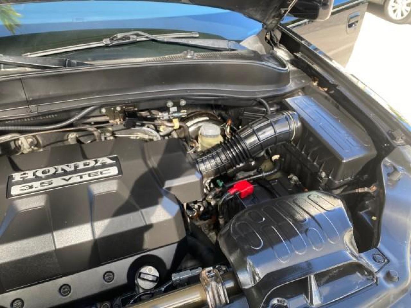 2007 Formal Black /Gray Honda Ridgeline RTL w/Leather 1 OWNER FL (2HJYK16557H) with an 3.5L SOHC PGM-FI 24-Valve VTEC V6 Engine engine, Automatic transmission, located at 4701 North Dixie Hwy, Pompano Beach, FL, 33064, (954) 422-2889, 26.240938, -80.123474 - OUR WEBPAGE FLORIDACARS1.COM HAS OVER 100 PHOTOS AND FREE CARFAX LINK 2007 HONDA RIDGELINE RTL 1 OWNER NEW $35,535 VIN: 2HJYK16557H543559 2 H J Y K 1 6 5 5 7 H 5 4 3 5 5 9 CREW PICKUP 3.5L V6 F SOHC 24V GASOLINE 21 MPG FRONT WHEEL DRIVE W/ 4X4 Features ABS Brakes Air Conditioning Alloy Wheels AM/FM - Photo#26