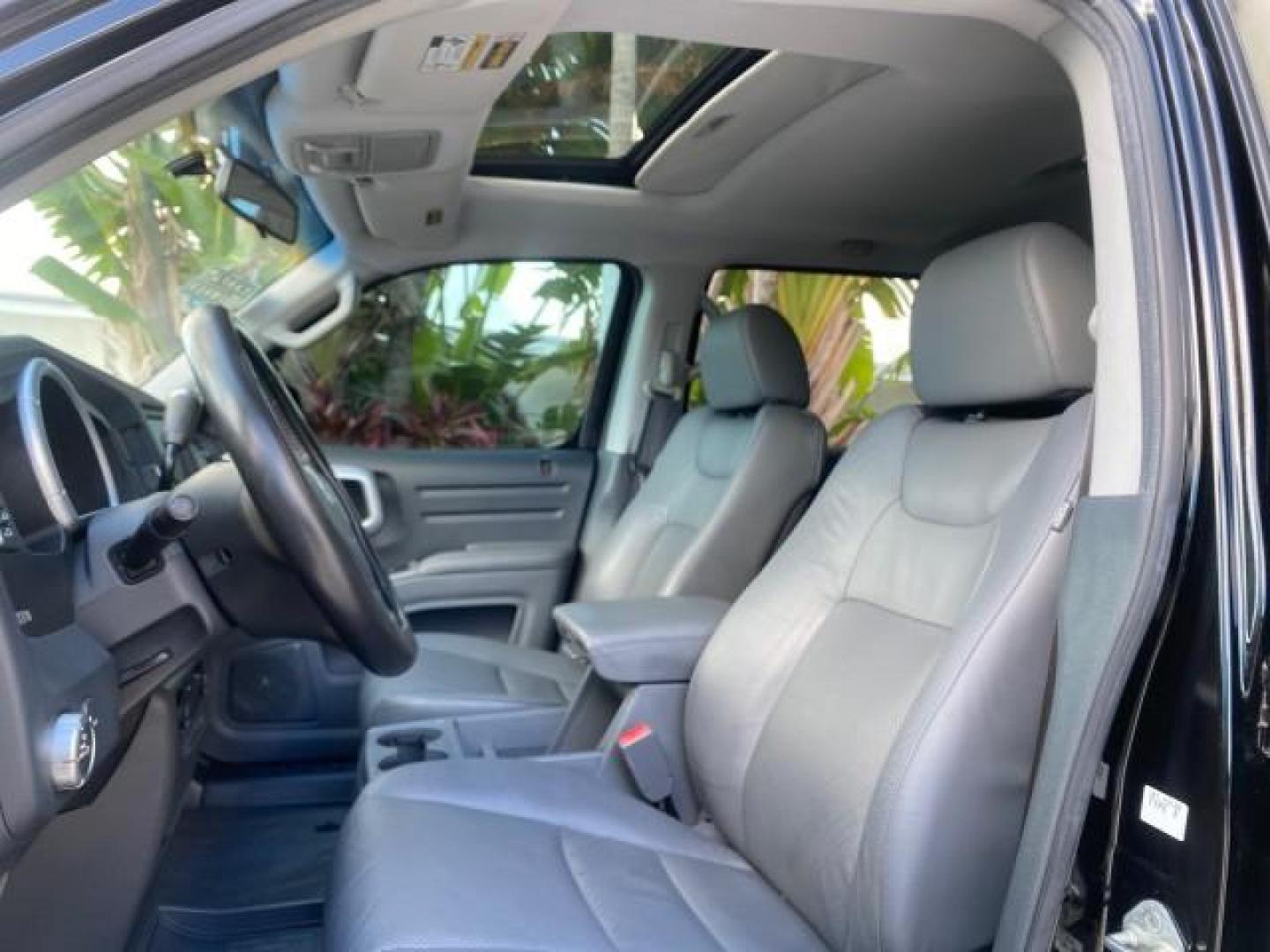 2007 Formal Black /Gray Honda Ridgeline RTL w/Leather 1 OWNER FL (2HJYK16557H) with an 3.5L SOHC PGM-FI 24-Valve VTEC V6 Engine engine, Automatic transmission, located at 4701 North Dixie Hwy, Pompano Beach, FL, 33064, (954) 422-2889, 26.240938, -80.123474 - OUR WEBPAGE FLORIDACARS1.COM HAS OVER 100 PHOTOS AND FREE CARFAX LINK 2007 HONDA RIDGELINE RTL 1 OWNER NEW $35,535 VIN: 2HJYK16557H543559 2 H J Y K 1 6 5 5 7 H 5 4 3 5 5 9 CREW PICKUP 3.5L V6 F SOHC 24V GASOLINE 21 MPG FRONT WHEEL DRIVE W/ 4X4 Features ABS Brakes Air Conditioning Alloy Wheels AM/FM - Photo#43