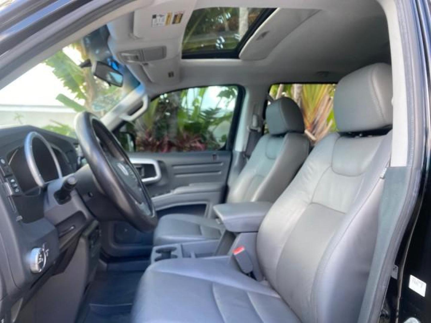 2007 Formal Black /Gray Honda Ridgeline RTL w/Leather 1 OWNER FL (2HJYK16557H) with an 3.5L SOHC PGM-FI 24-Valve VTEC V6 Engine engine, Automatic transmission, located at 4701 North Dixie Hwy, Pompano Beach, FL, 33064, (954) 422-2889, 26.240938, -80.123474 - OUR WEBPAGE FLORIDACARS1.COM HAS OVER 100 PHOTOS AND FREE CARFAX LINK 2007 HONDA RIDGELINE RTL 1 OWNER NEW $35,535 VIN: 2HJYK16557H543559 2 H J Y K 1 6 5 5 7 H 5 4 3 5 5 9 CREW PICKUP 3.5L V6 F SOHC 24V GASOLINE 21 MPG FRONT WHEEL DRIVE W/ 4X4 Features ABS Brakes Air Conditioning Alloy Wheels AM/FM - Photo#44