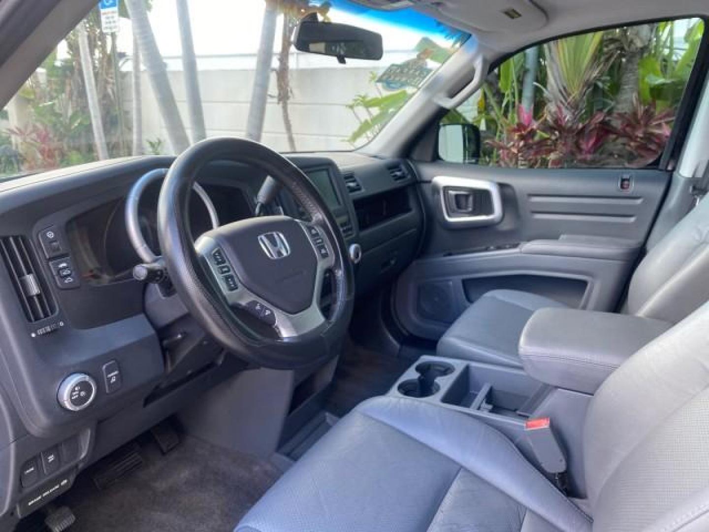2007 Formal Black /Gray Honda Ridgeline RTL w/Leather 1 OWNER FL (2HJYK16557H) with an 3.5L SOHC PGM-FI 24-Valve VTEC V6 Engine engine, Automatic transmission, located at 4701 North Dixie Hwy, Pompano Beach, FL, 33064, (954) 422-2889, 26.240938, -80.123474 - OUR WEBPAGE FLORIDACARS1.COM HAS OVER 100 PHOTOS AND FREE CARFAX LINK 2007 HONDA RIDGELINE RTL 1 OWNER NEW $35,535 VIN: 2HJYK16557H543559 2 H J Y K 1 6 5 5 7 H 5 4 3 5 5 9 CREW PICKUP 3.5L V6 F SOHC 24V GASOLINE 21 MPG FRONT WHEEL DRIVE W/ 4X4 Features ABS Brakes Air Conditioning Alloy Wheels AM/FM - Photo#46