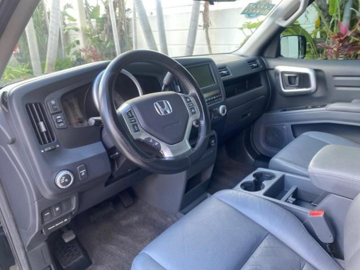 2007 Formal Black /Gray Honda Ridgeline RTL w/Leather 1 OWNER FL (2HJYK16557H) with an 3.5L SOHC PGM-FI 24-Valve VTEC V6 Engine engine, Automatic transmission, located at 4701 North Dixie Hwy, Pompano Beach, FL, 33064, (954) 422-2889, 26.240938, -80.123474 - OUR WEBPAGE FLORIDACARS1.COM HAS OVER 100 PHOTOS AND FREE CARFAX LINK 2007 HONDA RIDGELINE RTL 1 OWNER NEW $35,535 VIN: 2HJYK16557H543559 2 H J Y K 1 6 5 5 7 H 5 4 3 5 5 9 CREW PICKUP 3.5L V6 F SOHC 24V GASOLINE 21 MPG FRONT WHEEL DRIVE W/ 4X4 Features ABS Brakes Air Conditioning Alloy Wheels AM/FM - Photo#48