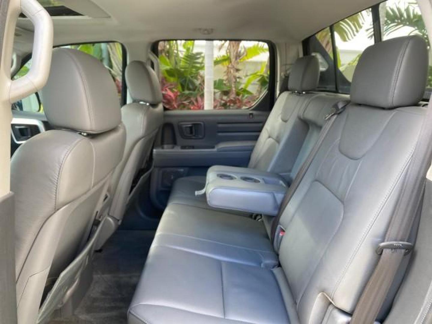 2007 Formal Black /Gray Honda Ridgeline RTL w/Leather 1 OWNER FL (2HJYK16557H) with an 3.5L SOHC PGM-FI 24-Valve VTEC V6 Engine engine, Automatic transmission, located at 4701 North Dixie Hwy, Pompano Beach, FL, 33064, (954) 422-2889, 26.240938, -80.123474 - OUR WEBPAGE FLORIDACARS1.COM HAS OVER 100 PHOTOS AND FREE CARFAX LINK 2007 HONDA RIDGELINE RTL 1 OWNER NEW $35,535 VIN: 2HJYK16557H543559 2 H J Y K 1 6 5 5 7 H 5 4 3 5 5 9 CREW PICKUP 3.5L V6 F SOHC 24V GASOLINE 21 MPG FRONT WHEEL DRIVE W/ 4X4 Features ABS Brakes Air Conditioning Alloy Wheels AM/FM - Photo#82