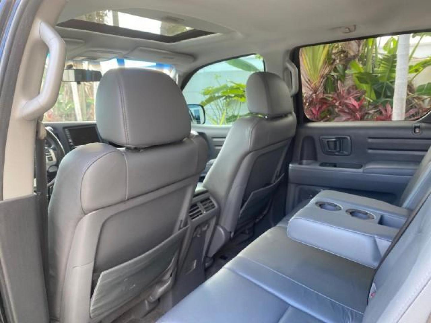 2007 Formal Black /Gray Honda Ridgeline RTL w/Leather 1 OWNER FL (2HJYK16557H) with an 3.5L SOHC PGM-FI 24-Valve VTEC V6 Engine engine, Automatic transmission, located at 4701 North Dixie Hwy, Pompano Beach, FL, 33064, (954) 422-2889, 26.240938, -80.123474 - OUR WEBPAGE FLORIDACARS1.COM HAS OVER 100 PHOTOS AND FREE CARFAX LINK 2007 HONDA RIDGELINE RTL 1 OWNER NEW $35,535 VIN: 2HJYK16557H543559 2 H J Y K 1 6 5 5 7 H 5 4 3 5 5 9 CREW PICKUP 3.5L V6 F SOHC 24V GASOLINE 21 MPG FRONT WHEEL DRIVE W/ 4X4 Features ABS Brakes Air Conditioning Alloy Wheels AM/FM - Photo#83