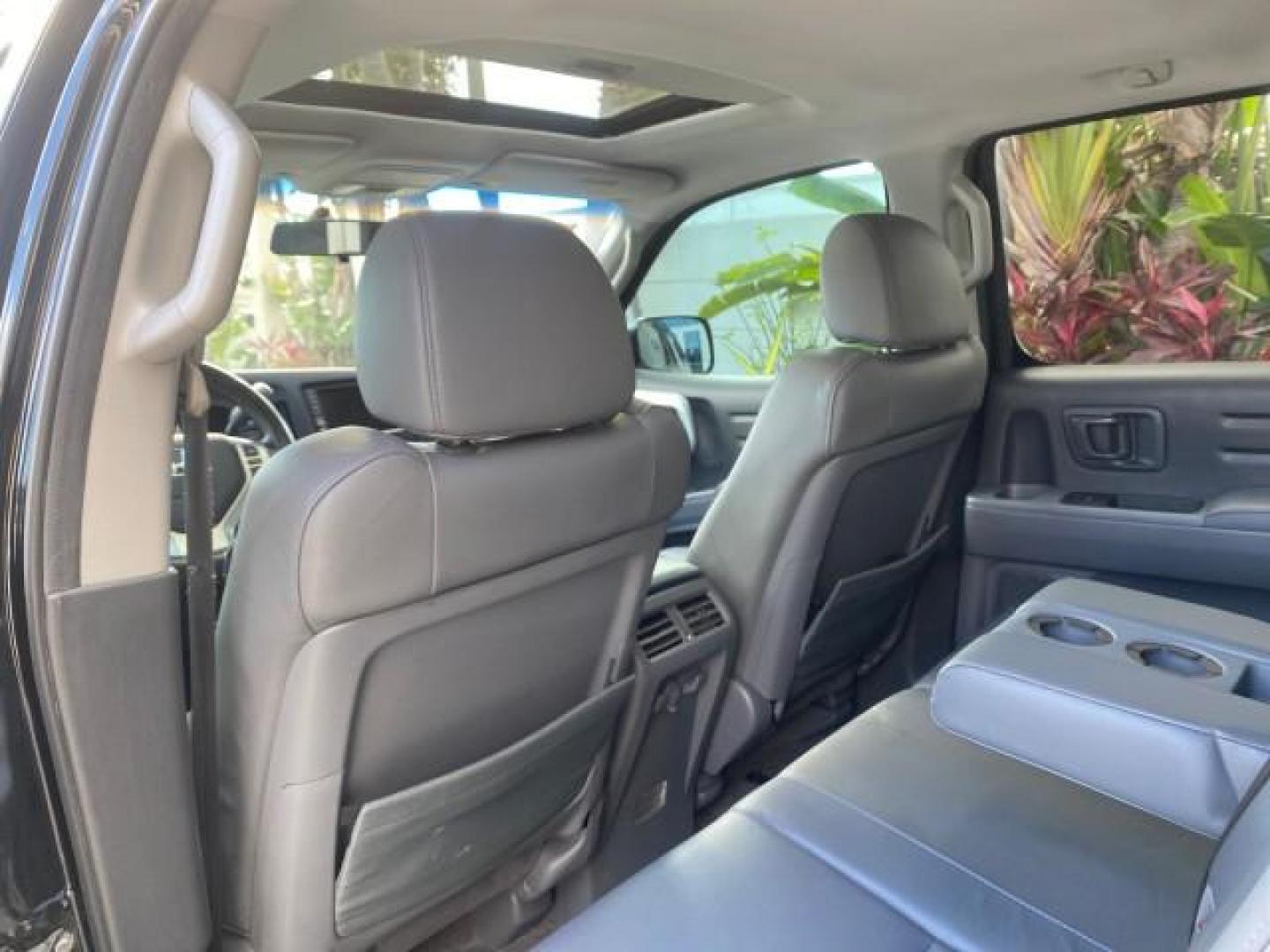 2007 Formal Black /Gray Honda Ridgeline RTL w/Leather 1 OWNER FL (2HJYK16557H) with an 3.5L SOHC PGM-FI 24-Valve VTEC V6 Engine engine, Automatic transmission, located at 4701 North Dixie Hwy, Pompano Beach, FL, 33064, (954) 422-2889, 26.240938, -80.123474 - OUR WEBPAGE FLORIDACARS1.COM HAS OVER 100 PHOTOS AND FREE CARFAX LINK 2007 HONDA RIDGELINE RTL 1 OWNER NEW $35,535 VIN: 2HJYK16557H543559 2 H J Y K 1 6 5 5 7 H 5 4 3 5 5 9 CREW PICKUP 3.5L V6 F SOHC 24V GASOLINE 21 MPG FRONT WHEEL DRIVE W/ 4X4 Features ABS Brakes Air Conditioning Alloy Wheels AM/FM - Photo#84