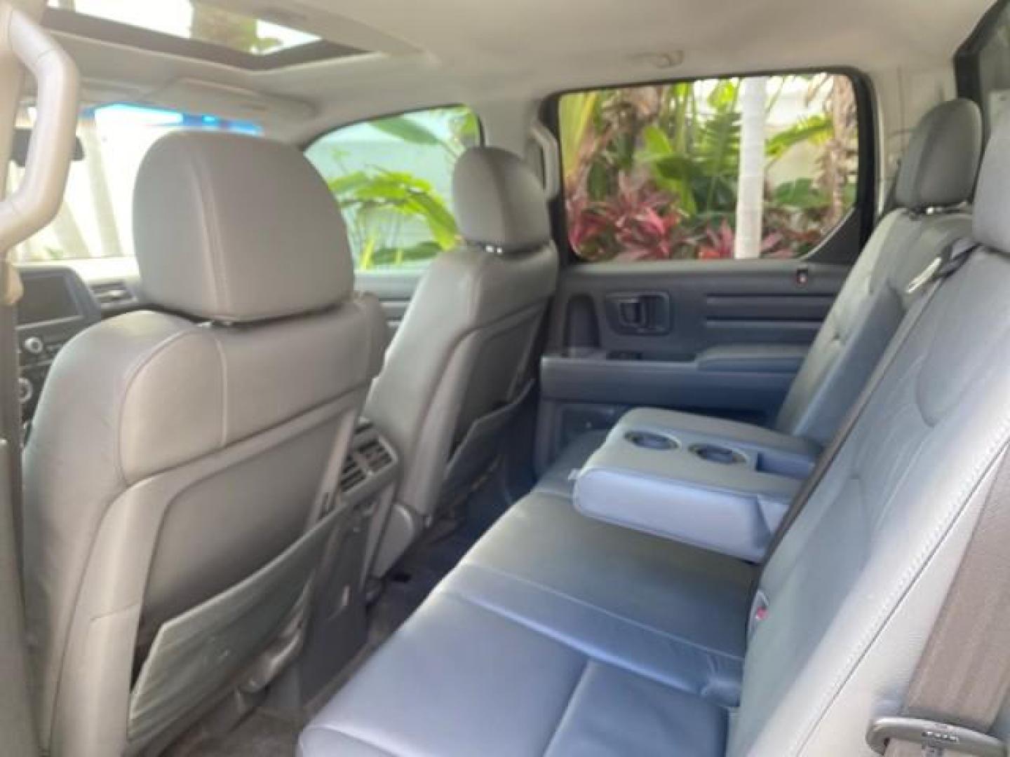 2007 Formal Black /Gray Honda Ridgeline RTL w/Leather 1 OWNER FL (2HJYK16557H) with an 3.5L SOHC PGM-FI 24-Valve VTEC V6 Engine engine, Automatic transmission, located at 4701 North Dixie Hwy, Pompano Beach, FL, 33064, (954) 422-2889, 26.240938, -80.123474 - OUR WEBPAGE FLORIDACARS1.COM HAS OVER 100 PHOTOS AND FREE CARFAX LINK 2007 HONDA RIDGELINE RTL 1 OWNER NEW $35,535 VIN: 2HJYK16557H543559 2 H J Y K 1 6 5 5 7 H 5 4 3 5 5 9 CREW PICKUP 3.5L V6 F SOHC 24V GASOLINE 21 MPG FRONT WHEEL DRIVE W/ 4X4 Features ABS Brakes Air Conditioning Alloy Wheels AM/FM - Photo#85