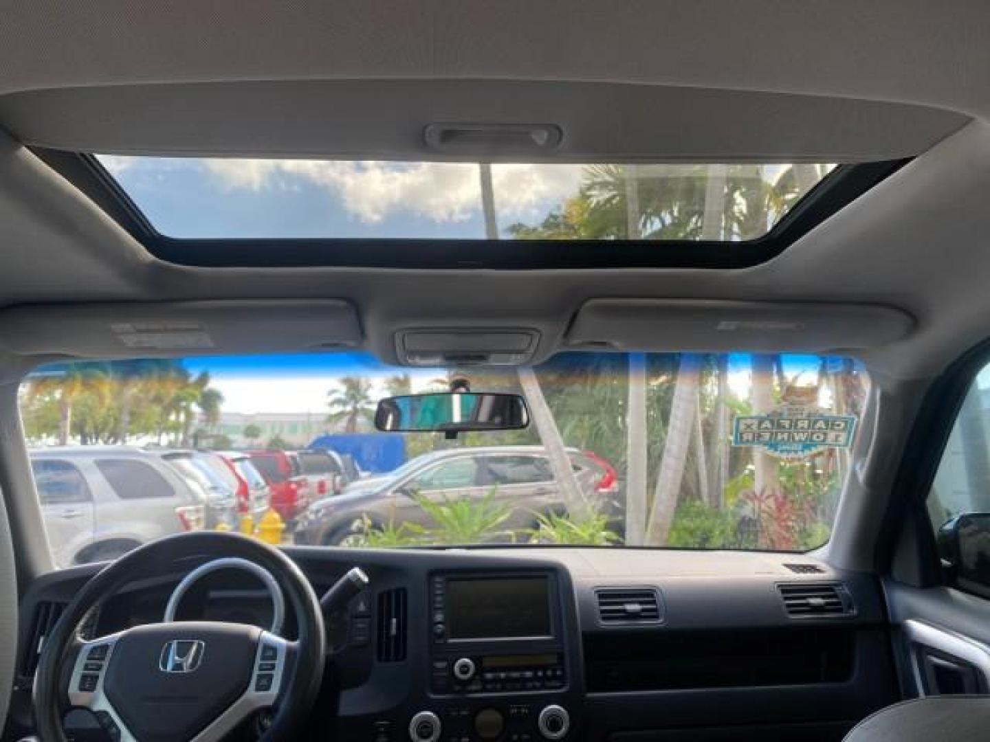 2007 Formal Black /Gray Honda Ridgeline RTL w/Leather 1 OWNER FL (2HJYK16557H) with an 3.5L SOHC PGM-FI 24-Valve VTEC V6 Engine engine, Automatic transmission, located at 4701 North Dixie Hwy, Pompano Beach, FL, 33064, (954) 422-2889, 26.240938, -80.123474 - OUR WEBPAGE FLORIDACARS1.COM HAS OVER 100 PHOTOS AND FREE CARFAX LINK 2007 HONDA RIDGELINE RTL 1 OWNER NEW $35,535 VIN: 2HJYK16557H543559 2 H J Y K 1 6 5 5 7 H 5 4 3 5 5 9 CREW PICKUP 3.5L V6 F SOHC 24V GASOLINE 21 MPG FRONT WHEEL DRIVE W/ 4X4 Features ABS Brakes Air Conditioning Alloy Wheels AM/FM - Photo#88