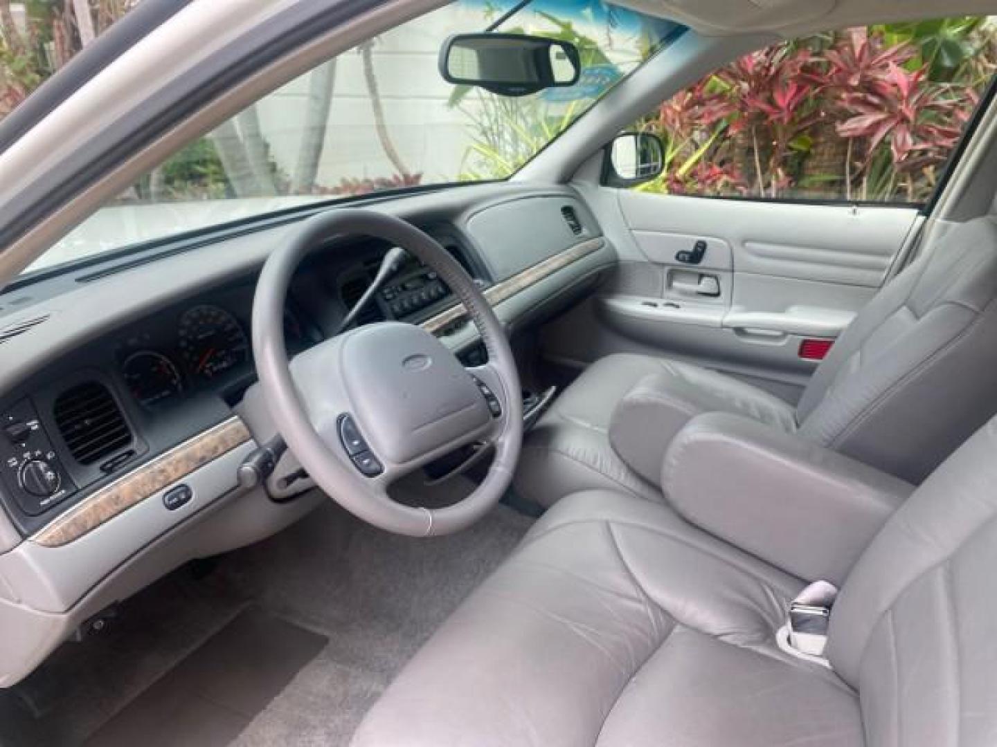 1999 Vibrant White /Lt/Med Parchment Ford Crown Victoria LX LOW MILES 61,537 (2FAFP74W6XX) with an 4.6L SMPI V8 Engine engine, Automatic transmission, located at 4701 North Dixie Hwy, Pompano Beach, FL, 33064, (954) 422-2889, 26.240938, -80.123474 - OUR WEBPAGE FLORIDACARS1.COM HAS OVER 100 PHOTOS AND FREE CARFAX LINK 1999 FORD CROWN VICTORIA LX VIN: 2FAFP74W6XX154498 2 F A F P 7 4 W 6 X X 1 5 4 4 9 8 SEDAN 4 DR 4.6L V8 F GASOLINE 26 MPG REAR WHEEL DRIVE Features ABS Brakes Air Conditioning AM/FM Stereo Automatic Transmission Cassette Player CD - Photo#46