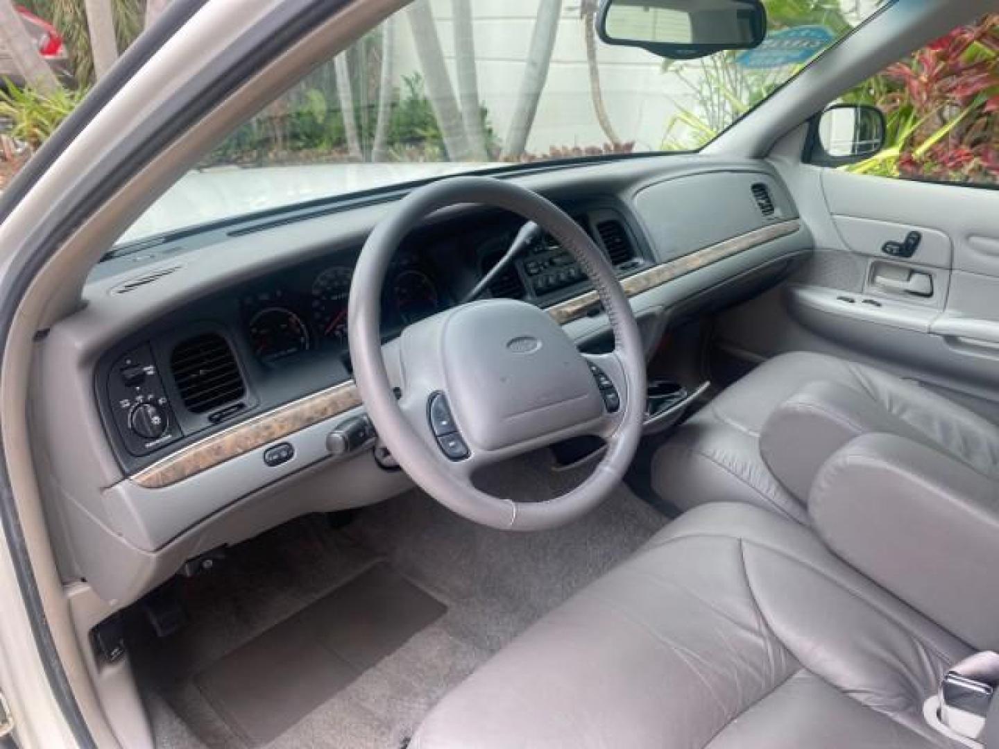 1999 Vibrant White /Lt/Med Parchment Ford Crown Victoria LX LOW MILES 61,537 (2FAFP74W6XX) with an 4.6L SMPI V8 Engine engine, Automatic transmission, located at 4701 North Dixie Hwy, Pompano Beach, FL, 33064, (954) 422-2889, 26.240938, -80.123474 - OUR WEBPAGE FLORIDACARS1.COM HAS OVER 100 PHOTOS AND FREE CARFAX LINK 1999 FORD CROWN VICTORIA LX VIN: 2FAFP74W6XX154498 2 F A F P 7 4 W 6 X X 1 5 4 4 9 8 SEDAN 4 DR 4.6L V8 F GASOLINE 26 MPG REAR WHEEL DRIVE Features ABS Brakes Air Conditioning AM/FM Stereo Automatic Transmission Cassette Player CD - Photo#47