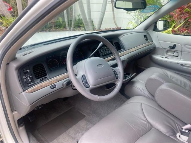 1999 Vibrant White /Lt/Med Parchment Ford Crown Victoria LX LOW MILES 61,537 (2FAFP74W6XX) with an 4.6L SMPI V8 Engine engine, Automatic transmission, located at 4701 North Dixie Hwy, Pompano Beach, FL, 33064, (954) 422-2889, 26.240938, -80.123474 - OUR WEBPAGE FLORIDACARS1.COM HAS OVER 100 PHOTOS AND FREE CARFAX LINK 1999 FORD CROWN VICTORIA LX VIN: 2FAFP74W6XX154498 2 F A F P 7 4 W 6 X X 1 5 4 4 9 8 SEDAN 4 DR 4.6L V8 F GASOLINE 26 MPG REAR WHEEL DRIVE Features ABS Brakes Air Conditioning AM/FM Stereo Automatic Transmission Cassette Player CD - Photo#47