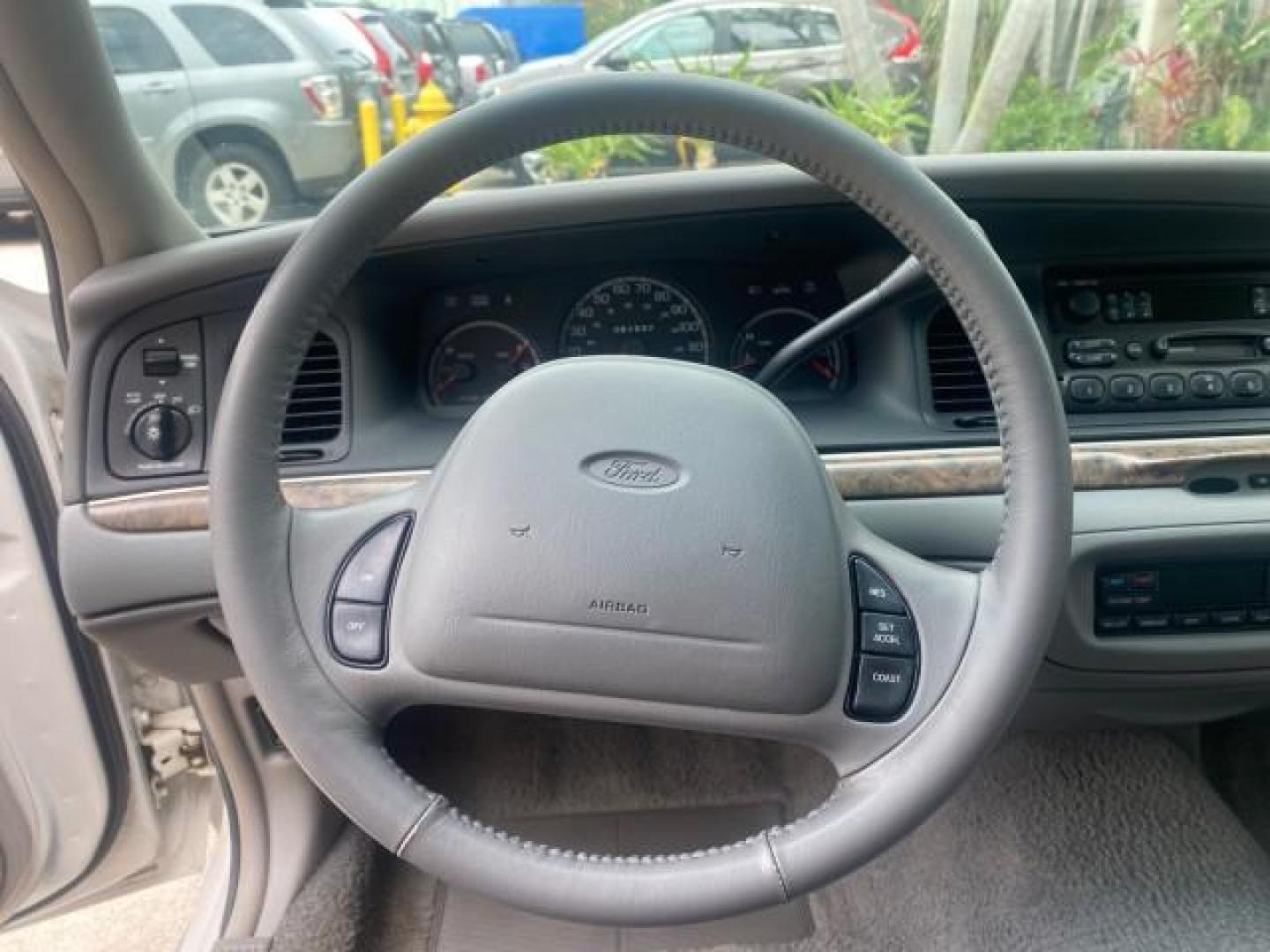 1999 Vibrant White /Lt/Med Parchment Ford Crown Victoria LX LOW MILES 61,537 (2FAFP74W6XX) with an 4.6L SMPI V8 Engine engine, Automatic transmission, located at 4701 North Dixie Hwy, Pompano Beach, FL, 33064, (954) 422-2889, 26.240938, -80.123474 - OUR WEBPAGE FLORIDACARS1.COM HAS OVER 100 PHOTOS AND FREE CARFAX LINK 1999 FORD CROWN VICTORIA LX VIN: 2FAFP74W6XX154498 2 F A F P 7 4 W 6 X X 1 5 4 4 9 8 SEDAN 4 DR 4.6L V8 F GASOLINE 26 MPG REAR WHEEL DRIVE Features ABS Brakes Air Conditioning AM/FM Stereo Automatic Transmission Cassette Player CD - Photo#51