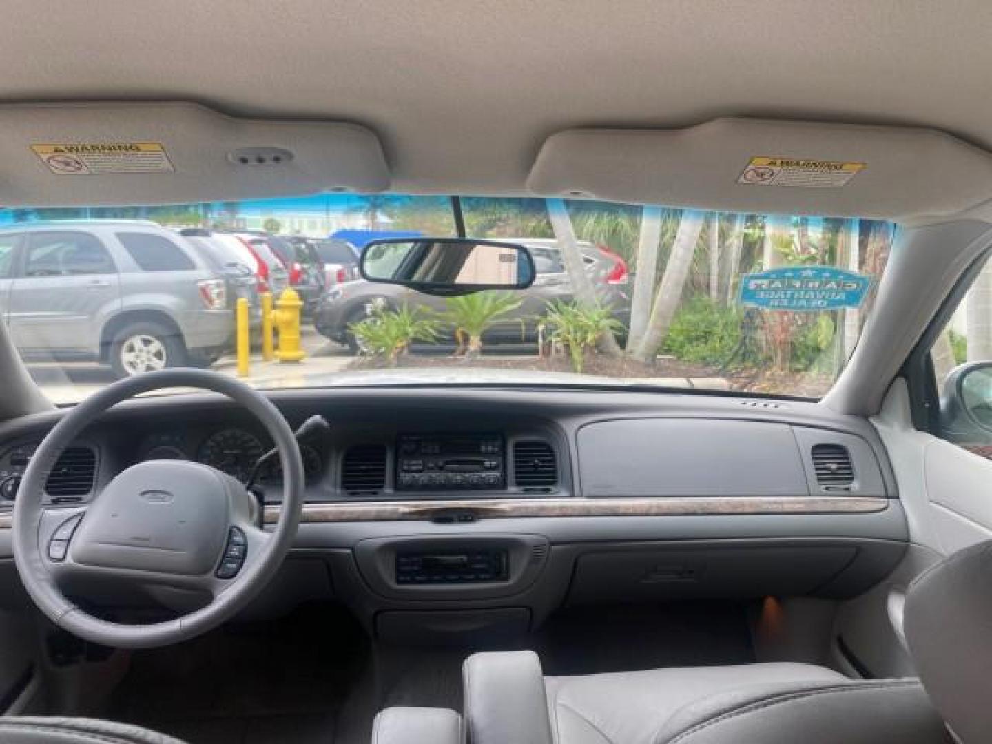 1999 Vibrant White /Lt/Med Parchment Ford Crown Victoria LX LOW MILES 61,537 (2FAFP74W6XX) with an 4.6L SMPI V8 Engine engine, Automatic transmission, located at 4701 North Dixie Hwy, Pompano Beach, FL, 33064, (954) 422-2889, 26.240938, -80.123474 - OUR WEBPAGE FLORIDACARS1.COM HAS OVER 100 PHOTOS AND FREE CARFAX LINK 1999 FORD CROWN VICTORIA LX VIN: 2FAFP74W6XX154498 2 F A F P 7 4 W 6 X X 1 5 4 4 9 8 SEDAN 4 DR 4.6L V8 F GASOLINE 26 MPG REAR WHEEL DRIVE Features ABS Brakes Air Conditioning AM/FM Stereo Automatic Transmission Cassette Player CD - Photo#77