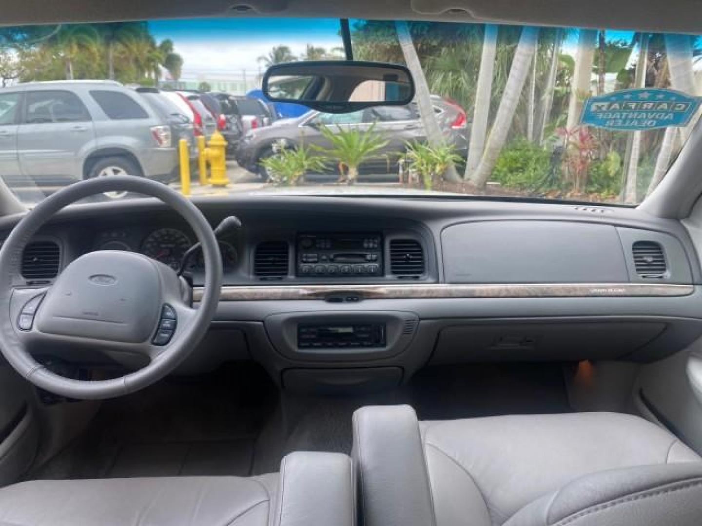 1999 Vibrant White /Lt/Med Parchment Ford Crown Victoria LX LOW MILES 61,537 (2FAFP74W6XX) with an 4.6L SMPI V8 Engine engine, Automatic transmission, located at 4701 North Dixie Hwy, Pompano Beach, FL, 33064, (954) 422-2889, 26.240938, -80.123474 - OUR WEBPAGE FLORIDACARS1.COM HAS OVER 100 PHOTOS AND FREE CARFAX LINK 1999 FORD CROWN VICTORIA LX VIN: 2FAFP74W6XX154498 2 F A F P 7 4 W 6 X X 1 5 4 4 9 8 SEDAN 4 DR 4.6L V8 F GASOLINE 26 MPG REAR WHEEL DRIVE Features ABS Brakes Air Conditioning AM/FM Stereo Automatic Transmission Cassette Player CD - Photo#78