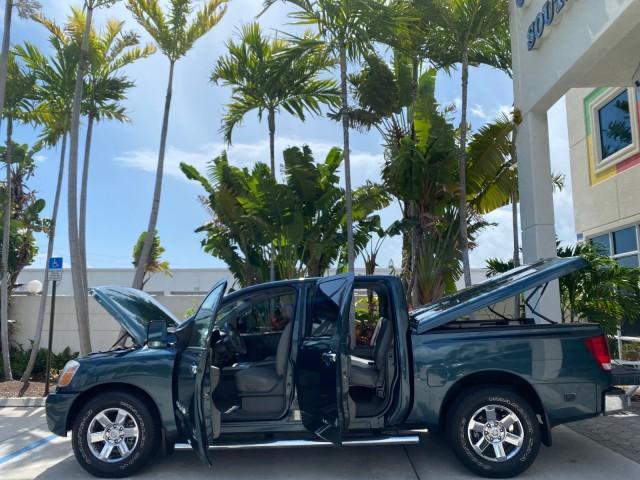 2007 Majestic Blue /Graphite/Titanium Nissan Titan LE 1 OWNER LOW MILES 39,670 CREW CAB (1N6BA07A67N) with an 5.6L DOHC 32-Valve V8 FFV Engine engine, Automatic transmission, located at 4701 North Dixie Hwy, Pompano Beach, FL, 33064, (954) 422-2889, 26.240938, -80.123474 - OUR WEBPAGE FLORIDACARS1.COM HAS OVER 100 PHOTOS AND FREE CARFAX LINK 2007 NISSAN TITAN LE FFV 1 OWNER CREW CAB LEATHER VIN: 1N6BA07A67N215171 1 N 6 B A 0 7 A 6 7 N 2 1 5 1 7 1 CREW PICKUP 5.6L V8 F DOHC 32V FLEX FUEL 19 MPG REAR WHEEL DRIVE Features ABS Brakes Air Conditioning Alloy Wheels AM/FM St - Photo#8