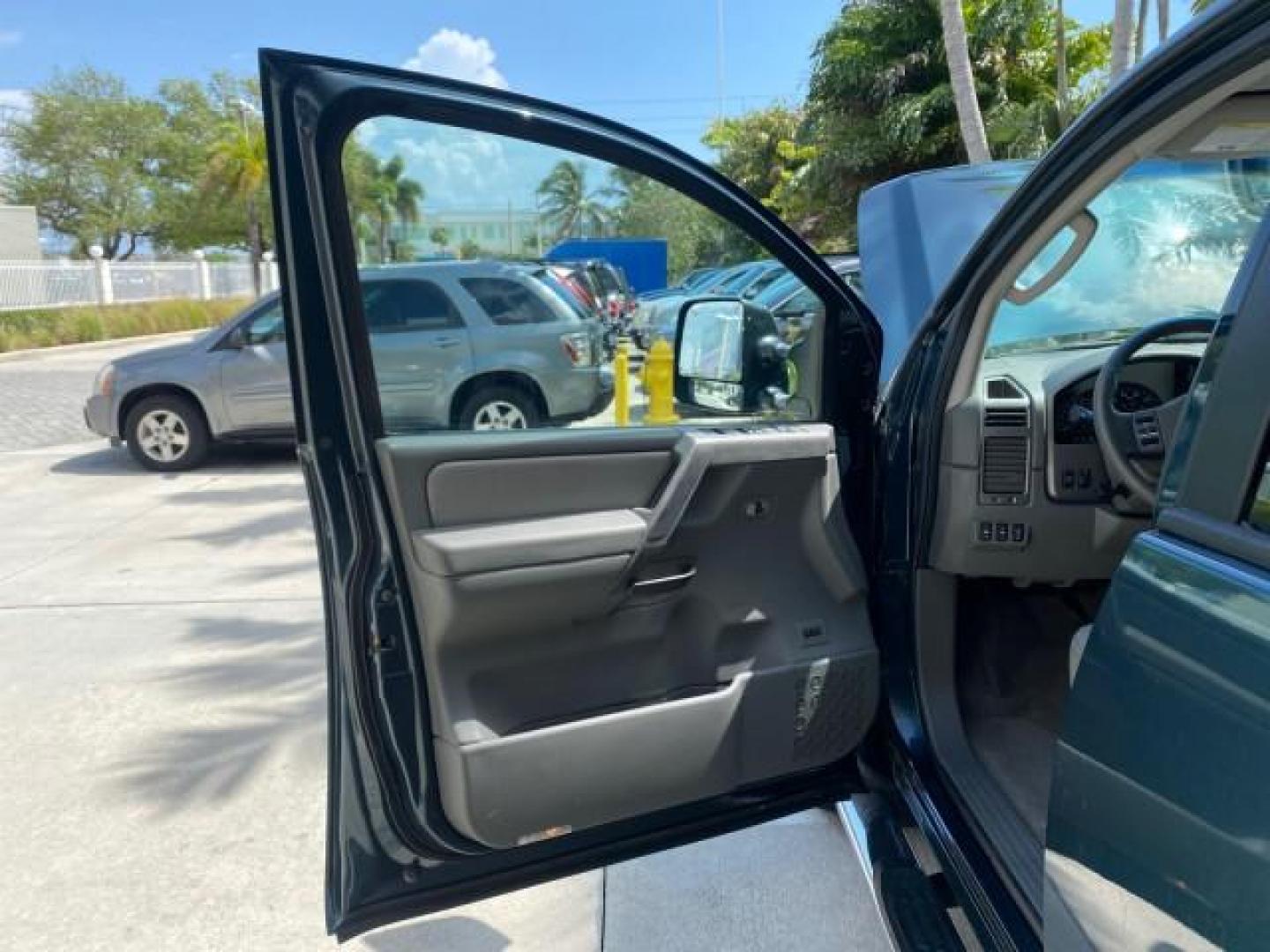 2007 Majestic Blue /Graphite/Titanium Nissan Titan LE 1 OWNER LOW MILES 39,670 CREW CAB (1N6BA07A67N) with an 5.6L DOHC 32-Valve V8 FFV Engine engine, Automatic transmission, located at 4701 North Dixie Hwy, Pompano Beach, FL, 33064, (954) 422-2889, 26.240938, -80.123474 - OUR WEBPAGE FLORIDACARS1.COM HAS OVER 100 PHOTOS AND FREE CARFAX LINK 2007 NISSAN TITAN LE FFV 1 OWNER CREW CAB LEATHER VIN: 1N6BA07A67N215171 1 N 6 B A 0 7 A 6 7 N 2 1 5 1 7 1 CREW PICKUP 5.6L V8 F DOHC 32V FLEX FUEL 19 MPG REAR WHEEL DRIVE Features ABS Brakes Air Conditioning Alloy Wheels AM/FM St - Photo#9