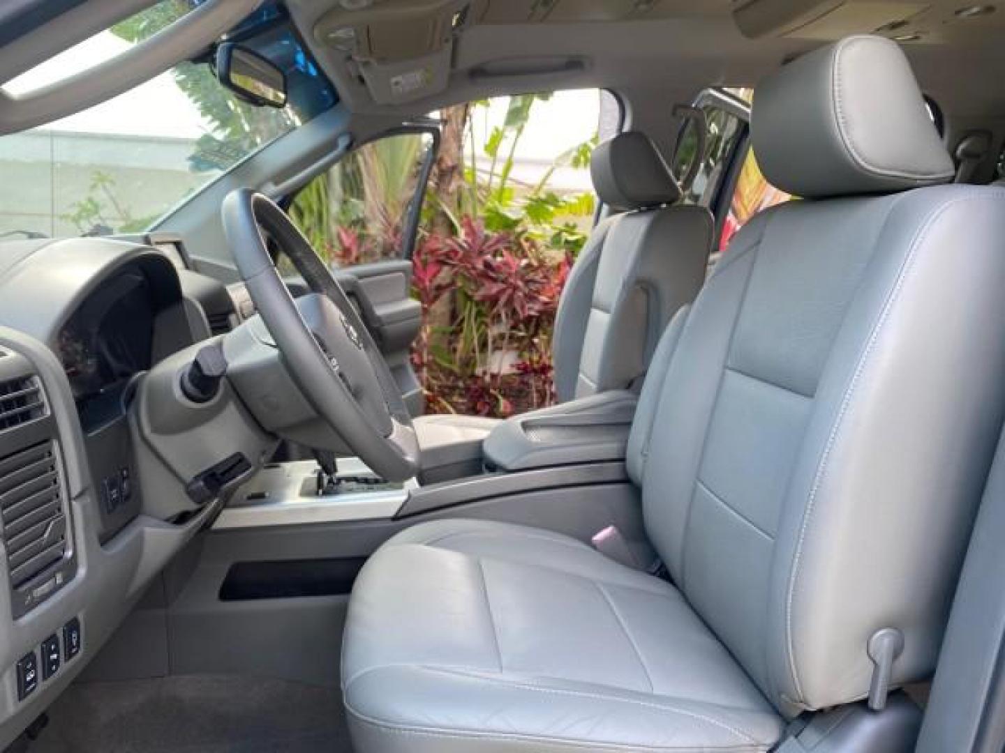 2007 Majestic Blue /Graphite/Titanium Nissan Titan LE 1 OWNER LOW MILES 39,670 CREW CAB (1N6BA07A67N) with an 5.6L DOHC 32-Valve V8 FFV Engine engine, Automatic transmission, located at 4701 North Dixie Hwy, Pompano Beach, FL, 33064, (954) 422-2889, 26.240938, -80.123474 - OUR WEBPAGE FLORIDACARS1.COM HAS OVER 100 PHOTOS AND FREE CARFAX LINK 2007 NISSAN TITAN LE FFV 1 OWNER CREW CAB LEATHER VIN: 1N6BA07A67N215171 1 N 6 B A 0 7 A 6 7 N 2 1 5 1 7 1 CREW PICKUP 5.6L V8 F DOHC 32V FLEX FUEL 19 MPG REAR WHEEL DRIVE Features ABS Brakes Air Conditioning Alloy Wheels AM/FM St - Photo#10