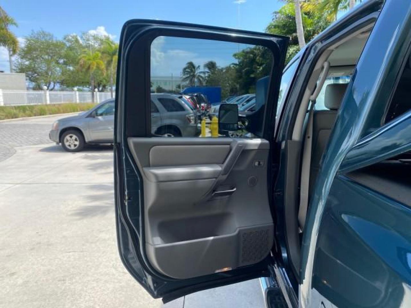 2007 Majestic Blue /Graphite/Titanium Nissan Titan LE 1 OWNER LOW MILES 39,670 CREW CAB (1N6BA07A67N) with an 5.6L DOHC 32-Valve V8 FFV Engine engine, Automatic transmission, located at 4701 North Dixie Hwy, Pompano Beach, FL, 33064, (954) 422-2889, 26.240938, -80.123474 - OUR WEBPAGE FLORIDACARS1.COM HAS OVER 100 PHOTOS AND FREE CARFAX LINK 2007 NISSAN TITAN LE FFV 1 OWNER CREW CAB LEATHER VIN: 1N6BA07A67N215171 1 N 6 B A 0 7 A 6 7 N 2 1 5 1 7 1 CREW PICKUP 5.6L V8 F DOHC 32V FLEX FUEL 19 MPG REAR WHEEL DRIVE Features ABS Brakes Air Conditioning Alloy Wheels AM/FM St - Photo#13