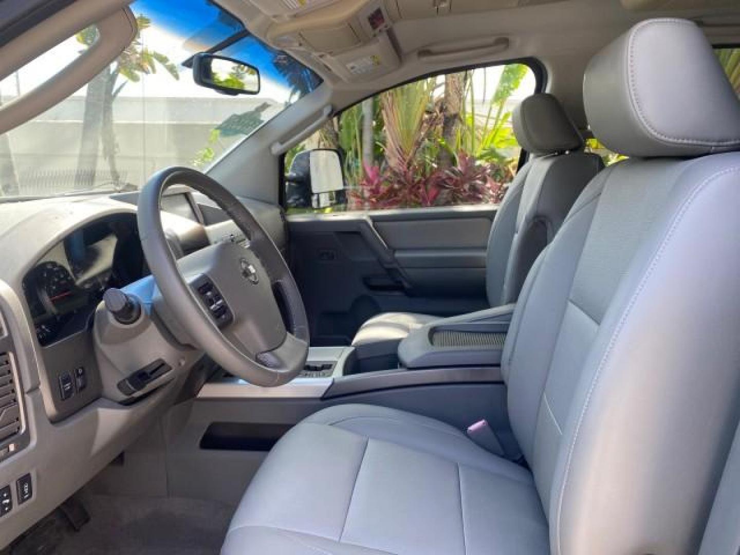 2007 Majestic Blue /Graphite/Titanium Nissan Titan LE 1 OWNER LOW MILES 39,670 CREW CAB (1N6BA07A67N) with an 5.6L DOHC 32-Valve V8 FFV Engine engine, Automatic transmission, located at 4701 North Dixie Hwy, Pompano Beach, FL, 33064, (954) 422-2889, 26.240938, -80.123474 - OUR WEBPAGE FLORIDACARS1.COM HAS OVER 100 PHOTOS AND FREE CARFAX LINK 2007 NISSAN TITAN LE FFV 1 OWNER CREW CAB LEATHER VIN: 1N6BA07A67N215171 1 N 6 B A 0 7 A 6 7 N 2 1 5 1 7 1 CREW PICKUP 5.6L V8 F DOHC 32V FLEX FUEL 19 MPG REAR WHEEL DRIVE Features ABS Brakes Air Conditioning Alloy Wheels AM/FM St - Photo#46