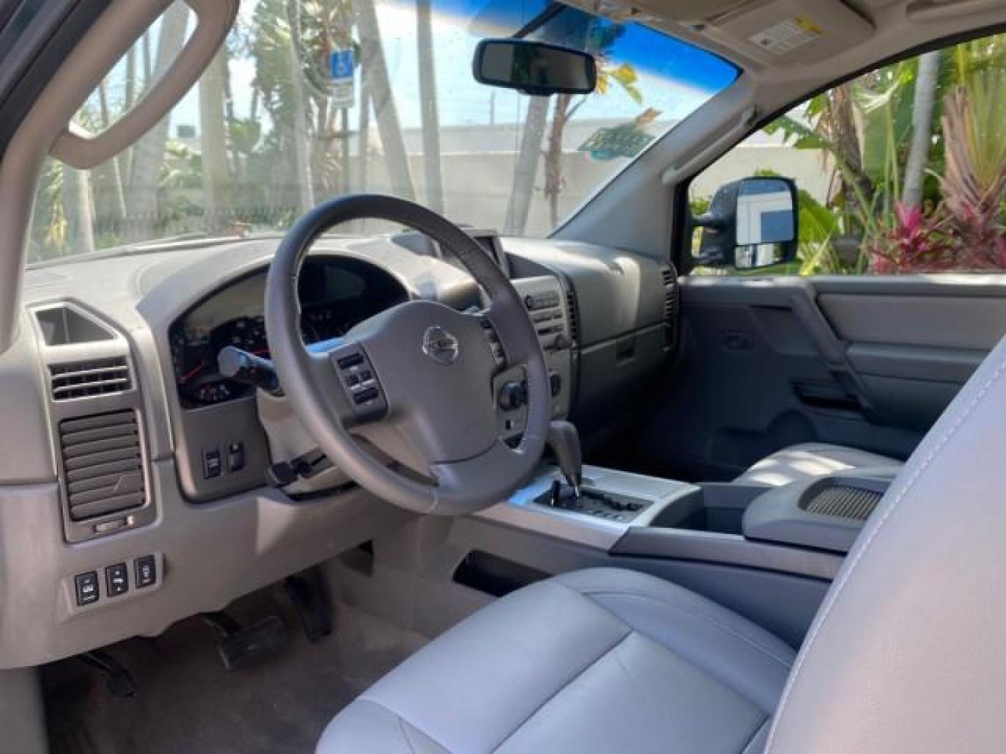 2007 Majestic Blue /Graphite/Titanium Nissan Titan LE 1 OWNER LOW MILES 39,670 CREW CAB (1N6BA07A67N) with an 5.6L DOHC 32-Valve V8 FFV Engine engine, Automatic transmission, located at 4701 North Dixie Hwy, Pompano Beach, FL, 33064, (954) 422-2889, 26.240938, -80.123474 - OUR WEBPAGE FLORIDACARS1.COM HAS OVER 100 PHOTOS AND FREE CARFAX LINK 2007 NISSAN TITAN LE FFV 1 OWNER CREW CAB LEATHER VIN: 1N6BA07A67N215171 1 N 6 B A 0 7 A 6 7 N 2 1 5 1 7 1 CREW PICKUP 5.6L V8 F DOHC 32V FLEX FUEL 19 MPG REAR WHEEL DRIVE Features ABS Brakes Air Conditioning Alloy Wheels AM/FM St - Photo#48