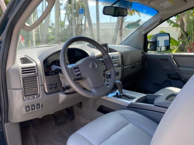 2007 Majestic Blue /Graphite/Titanium Nissan Titan LE 1 OWNER LOW MILES 39,670 CREW CAB (1N6BA07A67N) with an 5.6L DOHC 32-Valve V8 FFV Engine engine, Automatic transmission, located at 4701 North Dixie Hwy, Pompano Beach, FL, 33064, (954) 422-2889, 26.240938, -80.123474 - OUR WEBPAGE FLORIDACARS1.COM HAS OVER 100 PHOTOS AND FREE CARFAX LINK 2007 NISSAN TITAN LE FFV 1 OWNER CREW CAB LEATHER VIN: 1N6BA07A67N215171 1 N 6 B A 0 7 A 6 7 N 2 1 5 1 7 1 CREW PICKUP 5.6L V8 F DOHC 32V FLEX FUEL 19 MPG REAR WHEEL DRIVE Features ABS Brakes Air Conditioning Alloy Wheels AM/FM St - Photo#49