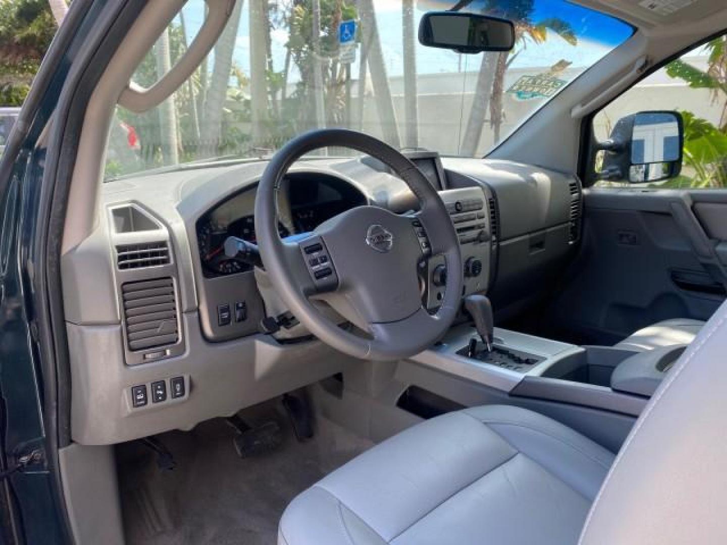 2007 Majestic Blue /Graphite/Titanium Nissan Titan LE 1 OWNER LOW MILES 39,670 CREW CAB (1N6BA07A67N) with an 5.6L DOHC 32-Valve V8 FFV Engine engine, Automatic transmission, located at 4701 North Dixie Hwy, Pompano Beach, FL, 33064, (954) 422-2889, 26.240938, -80.123474 - OUR WEBPAGE FLORIDACARS1.COM HAS OVER 100 PHOTOS AND FREE CARFAX LINK 2007 NISSAN TITAN LE FFV 1 OWNER CREW CAB LEATHER VIN: 1N6BA07A67N215171 1 N 6 B A 0 7 A 6 7 N 2 1 5 1 7 1 CREW PICKUP 5.6L V8 F DOHC 32V FLEX FUEL 19 MPG REAR WHEEL DRIVE Features ABS Brakes Air Conditioning Alloy Wheels AM/FM St - Photo#50