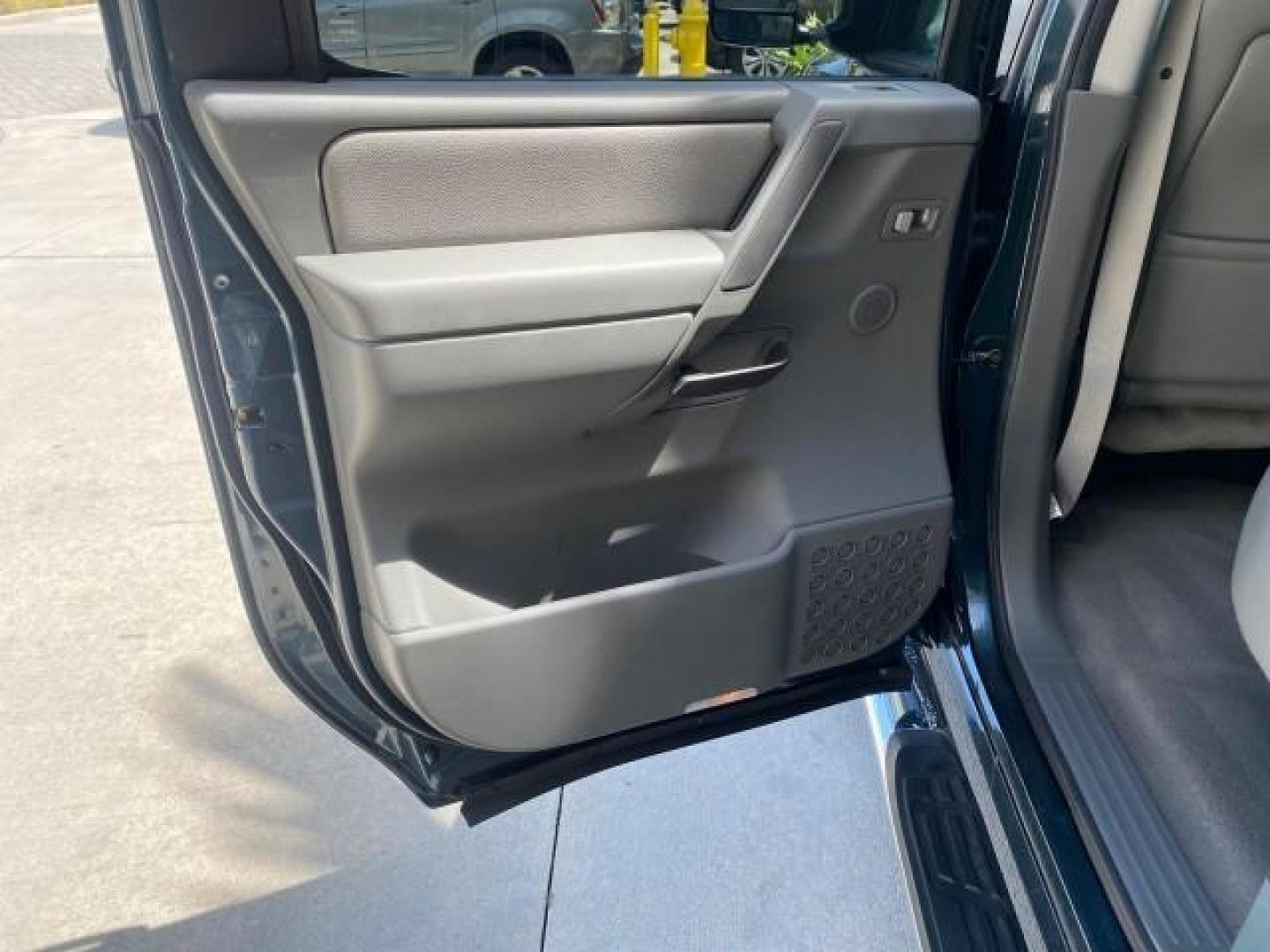 2007 Majestic Blue /Graphite/Titanium Nissan Titan LE 1 OWNER LOW MILES 39,670 CREW CAB (1N6BA07A67N) with an 5.6L DOHC 32-Valve V8 FFV Engine engine, Automatic transmission, located at 4701 North Dixie Hwy, Pompano Beach, FL, 33064, (954) 422-2889, 26.240938, -80.123474 - OUR WEBPAGE FLORIDACARS1.COM HAS OVER 100 PHOTOS AND FREE CARFAX LINK 2007 NISSAN TITAN LE FFV 1 OWNER CREW CAB LEATHER VIN: 1N6BA07A67N215171 1 N 6 B A 0 7 A 6 7 N 2 1 5 1 7 1 CREW PICKUP 5.6L V8 F DOHC 32V FLEX FUEL 19 MPG REAR WHEEL DRIVE Features ABS Brakes Air Conditioning Alloy Wheels AM/FM St - Photo#79