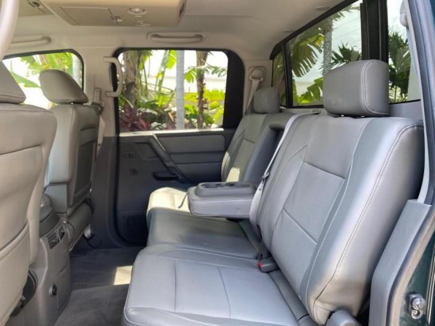 2007 Majestic Blue /Graphite/Titanium Nissan Titan LE 1 OWNER LOW MILES 39,670 CREW CAB (1N6BA07A67N) with an 5.6L DOHC 32-Valve V8 FFV Engine engine, Automatic transmission, located at 4701 North Dixie Hwy, Pompano Beach, FL, 33064, (954) 422-2889, 26.240938, -80.123474 - OUR WEBPAGE FLORIDACARS1.COM HAS OVER 100 PHOTOS AND FREE CARFAX LINK 2007 NISSAN TITAN LE FFV 1 OWNER CREW CAB LEATHER VIN: 1N6BA07A67N215171 1 N 6 B A 0 7 A 6 7 N 2 1 5 1 7 1 CREW PICKUP 5.6L V8 F DOHC 32V FLEX FUEL 19 MPG REAR WHEEL DRIVE Features ABS Brakes Air Conditioning Alloy Wheels AM/FM St - Photo#80