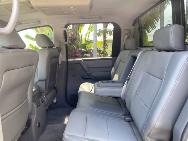 2007 Majestic Blue /Graphite/Titanium Nissan Titan LE 1 OWNER LOW MILES 39,670 CREW CAB (1N6BA07A67N) with an 5.6L DOHC 32-Valve V8 FFV Engine engine, Automatic transmission, located at 4701 North Dixie Hwy, Pompano Beach, FL, 33064, (954) 422-2889, 26.240938, -80.123474 - OUR WEBPAGE FLORIDACARS1.COM HAS OVER 100 PHOTOS AND FREE CARFAX LINK 2007 NISSAN TITAN LE FFV 1 OWNER CREW CAB LEATHER VIN: 1N6BA07A67N215171 1 N 6 B A 0 7 A 6 7 N 2 1 5 1 7 1 CREW PICKUP 5.6L V8 F DOHC 32V FLEX FUEL 19 MPG REAR WHEEL DRIVE Features ABS Brakes Air Conditioning Alloy Wheels AM/FM St - Photo#81