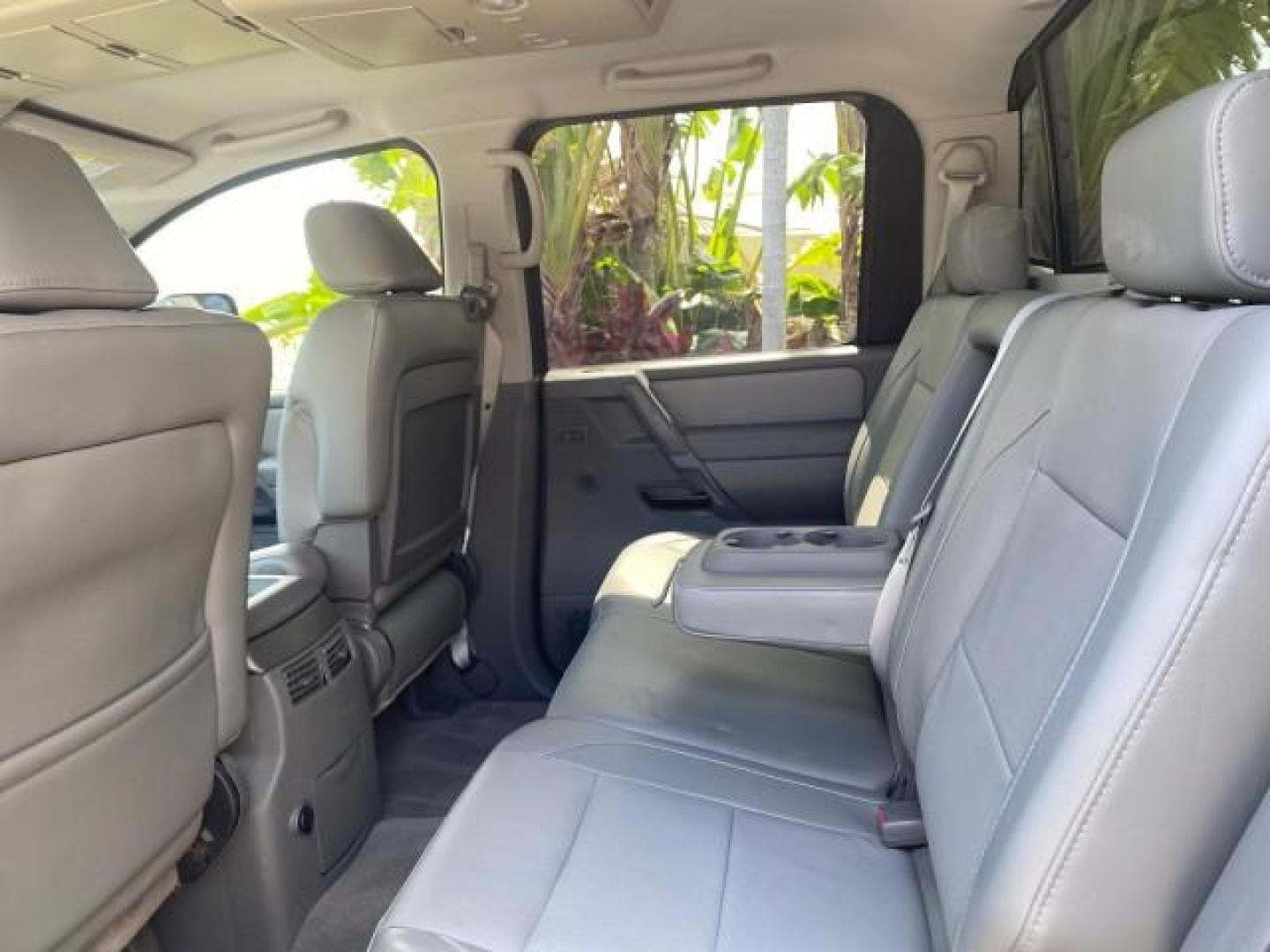 2007 Majestic Blue /Graphite/Titanium Nissan Titan LE 1 OWNER LOW MILES 39,670 CREW CAB (1N6BA07A67N) with an 5.6L DOHC 32-Valve V8 FFV Engine engine, Automatic transmission, located at 4701 North Dixie Hwy, Pompano Beach, FL, 33064, (954) 422-2889, 26.240938, -80.123474 - OUR WEBPAGE FLORIDACARS1.COM HAS OVER 100 PHOTOS AND FREE CARFAX LINK 2007 NISSAN TITAN LE FFV 1 OWNER CREW CAB LEATHER VIN: 1N6BA07A67N215171 1 N 6 B A 0 7 A 6 7 N 2 1 5 1 7 1 CREW PICKUP 5.6L V8 F DOHC 32V FLEX FUEL 19 MPG REAR WHEEL DRIVE Features ABS Brakes Air Conditioning Alloy Wheels AM/FM St - Photo#82