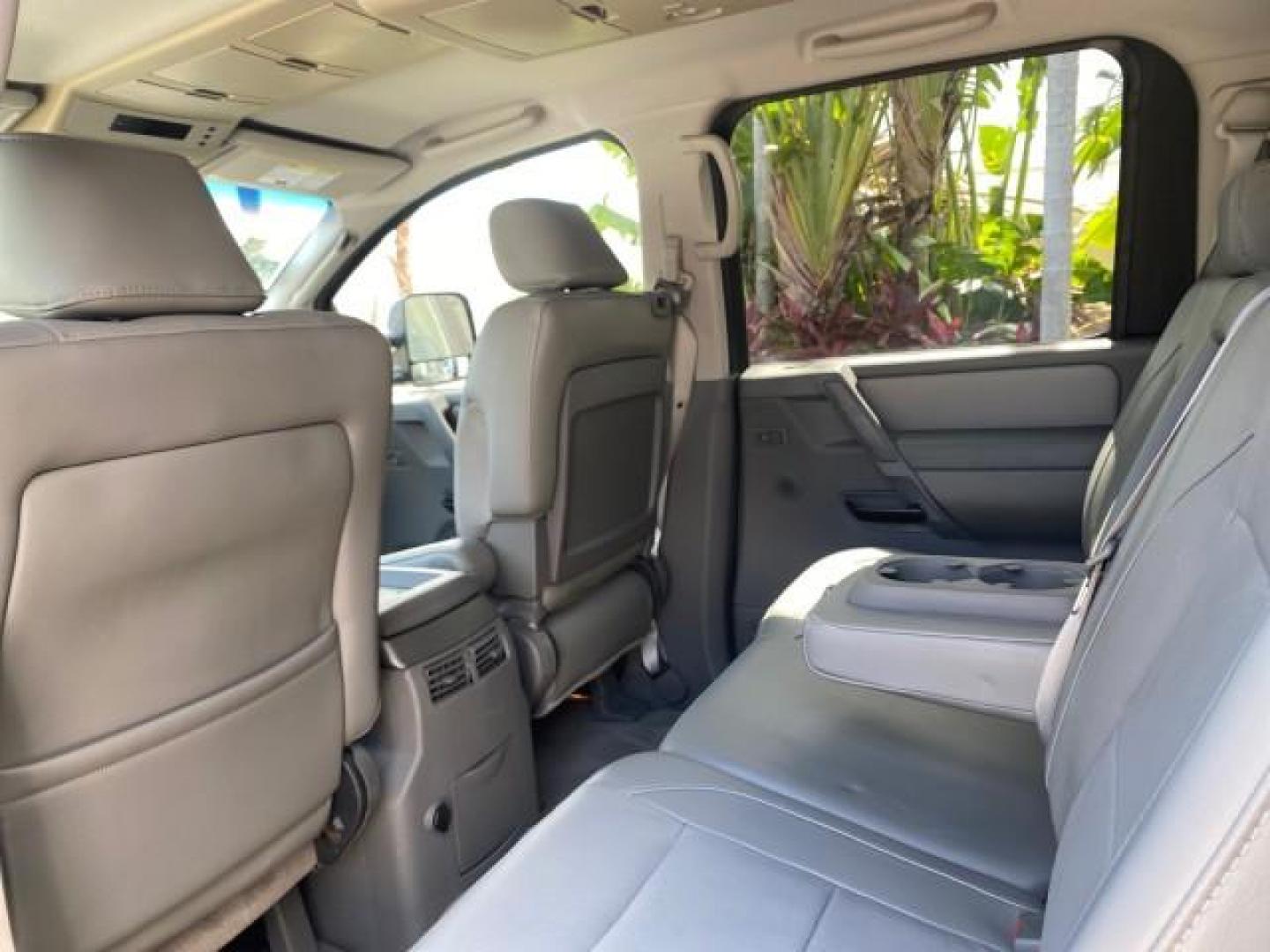 2007 Majestic Blue /Graphite/Titanium Nissan Titan LE 1 OWNER LOW MILES 39,670 CREW CAB (1N6BA07A67N) with an 5.6L DOHC 32-Valve V8 FFV Engine engine, Automatic transmission, located at 4701 North Dixie Hwy, Pompano Beach, FL, 33064, (954) 422-2889, 26.240938, -80.123474 - OUR WEBPAGE FLORIDACARS1.COM HAS OVER 100 PHOTOS AND FREE CARFAX LINK 2007 NISSAN TITAN LE FFV 1 OWNER CREW CAB LEATHER VIN: 1N6BA07A67N215171 1 N 6 B A 0 7 A 6 7 N 2 1 5 1 7 1 CREW PICKUP 5.6L V8 F DOHC 32V FLEX FUEL 19 MPG REAR WHEEL DRIVE Features ABS Brakes Air Conditioning Alloy Wheels AM/FM St - Photo#83